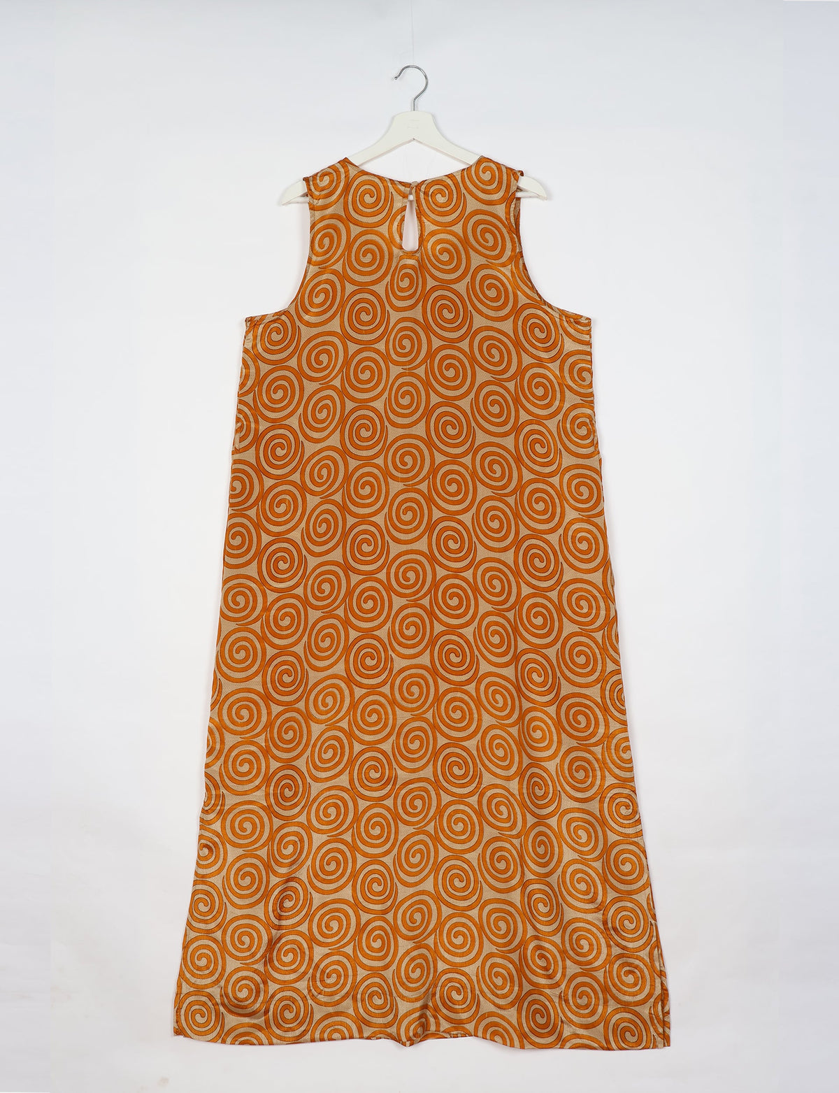Sleeveless A-Line maxi dress made from recycled saris, showcasing eco clothing and green fashion. A chic example of upcycled women's clothing and climate neutral clothing, perfect for fans of circular fashion, carbon neutral fashion, and products made from textile waste.