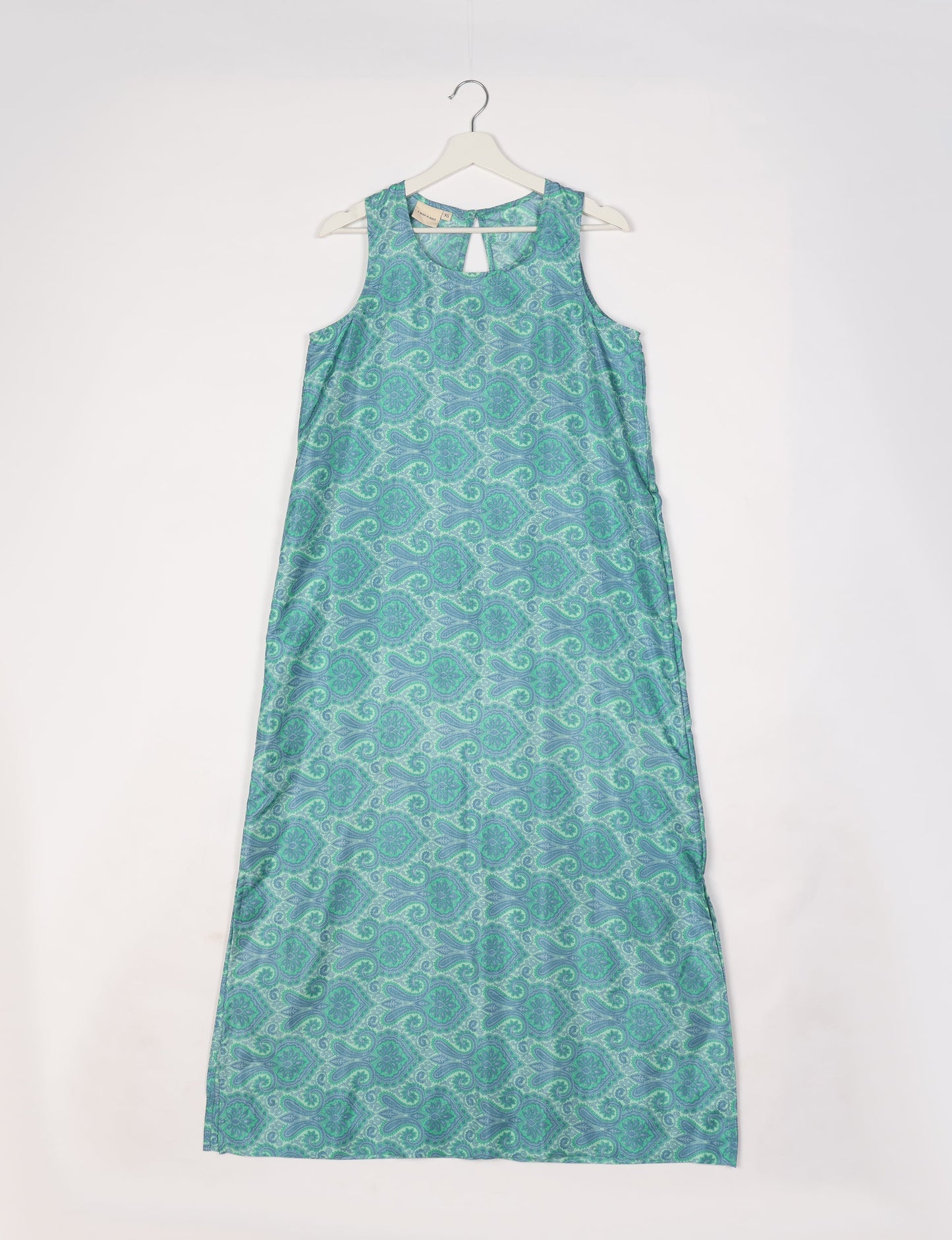 Sleeveless A-Line maxi dress made from recycled saris, showcasing eco clothing and green fashion. A chic example of upcycled women's clothing and climate neutral clothing, perfect for fans of circular fashion, carbon neutral fashion, and products made from textile waste.