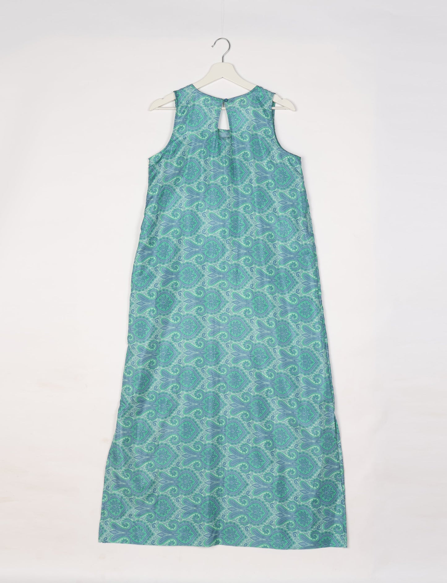 Sleeveless A-Line maxi dress made from recycled saris, showcasing eco clothing and green fashion. A chic example of upcycled women's clothing and climate neutral clothing, perfect for fans of circular fashion, carbon neutral fashion, and products made from textile waste.