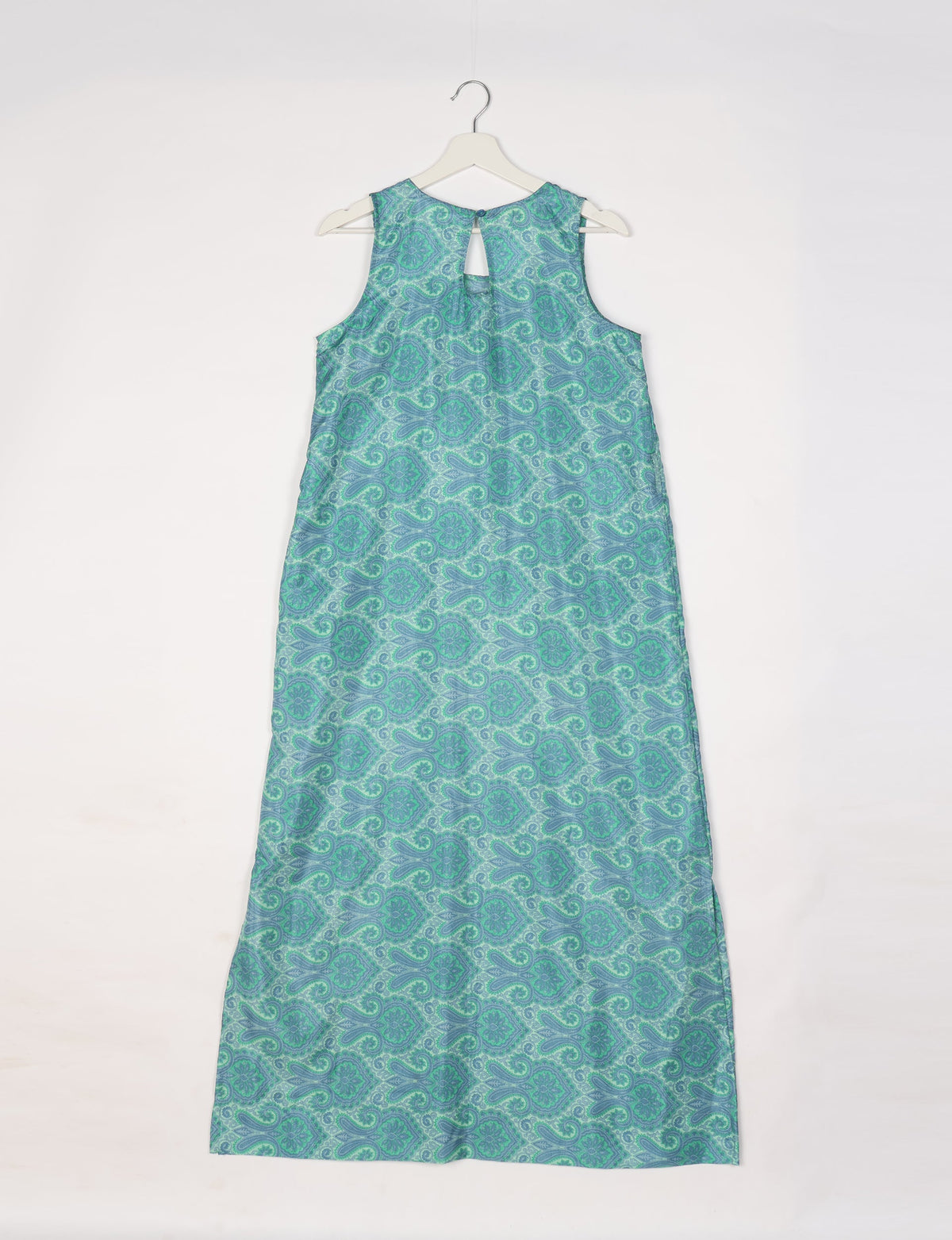 Blue and green sleeveless A-line maxi dress with Indian ethnic paisley pattern, keyhole back, hanging on white hanger