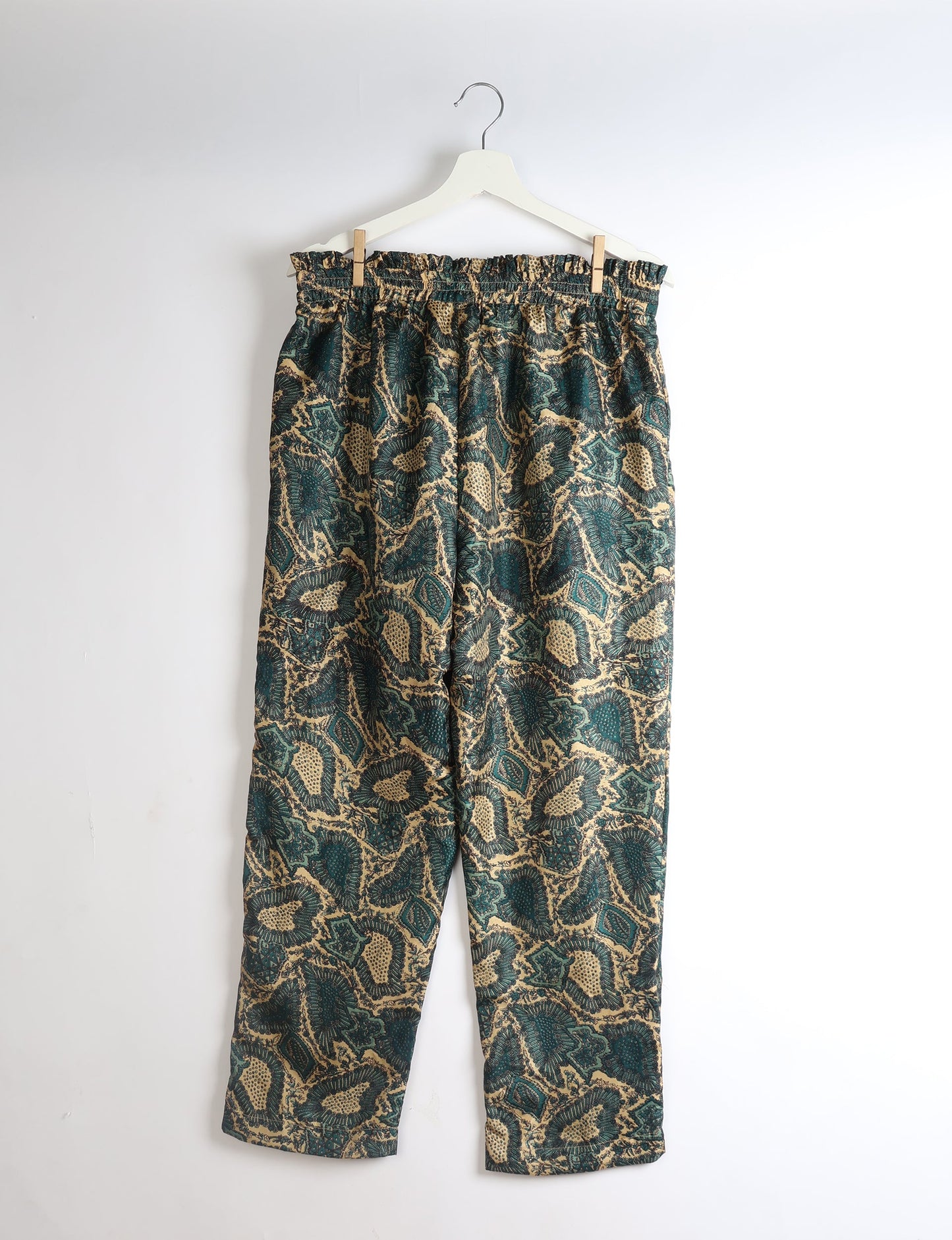 Paperbag high waisted pull-on pants for women made from upcycled garments and recycled fabric, featuring eco clothing design with an elasticated waistband and side pockets. A beautiful example of sustainable women’s clothing and environmentally friendly clothing inspired by upcycling fashion and green fashion movements.