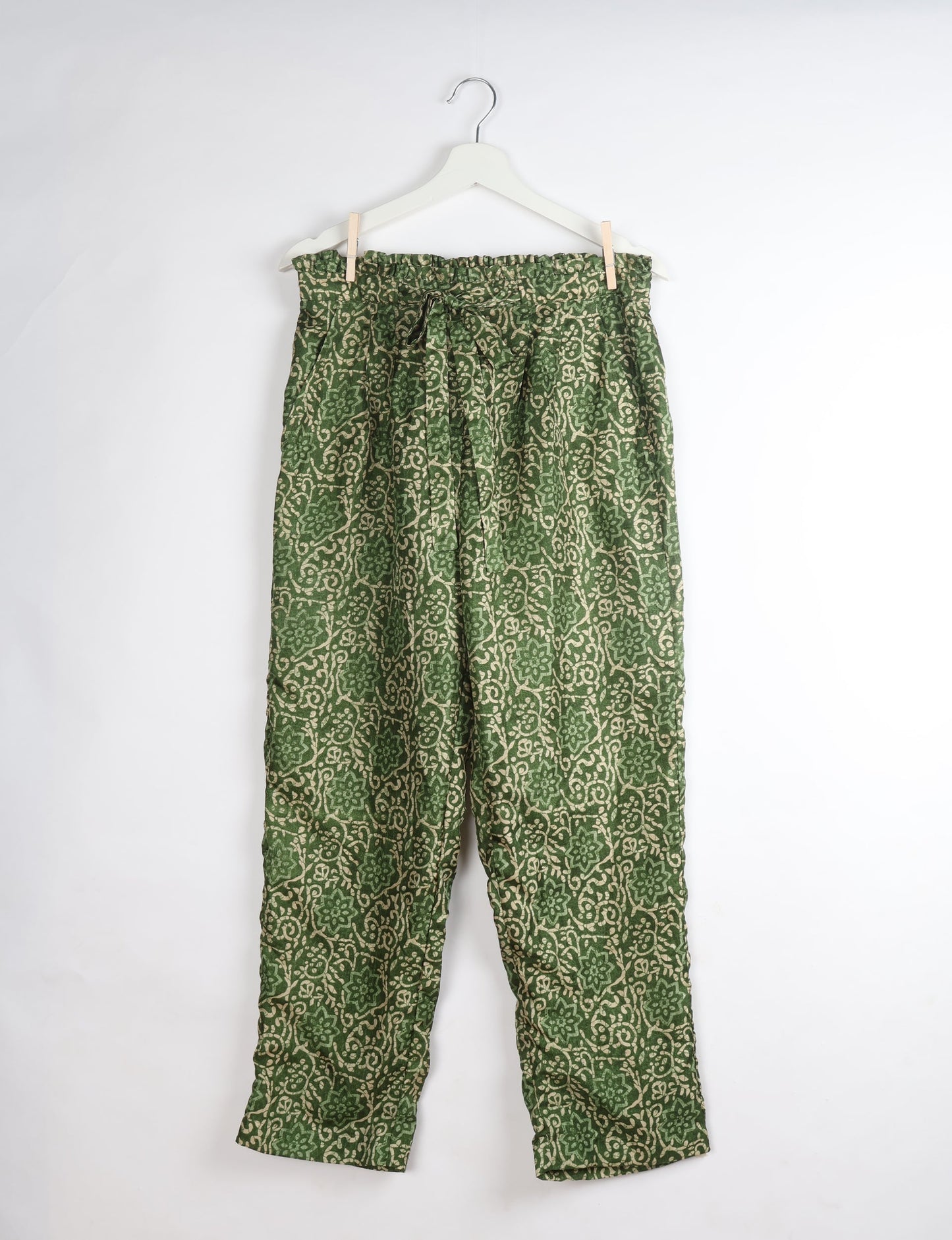 Paperbag high waisted pull-on pants for women made from upcycled garments and recycled fabric, featuring eco clothing design with an elasticated waistband and side pockets. A beautiful example of sustainable women’s clothing and environmentally friendly clothing inspired by upcycling fashion and green fashion movements.