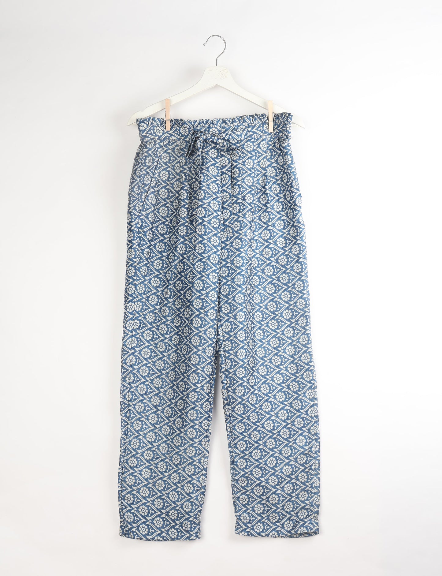 Paperbag high waisted pull-on pants for women made from upcycled garments and recycled fabric, featuring eco clothing design with an elasticated waistband and side pockets. A beautiful example of sustainable women’s clothing and environmentally friendly clothing inspired by upcycling fashion and green fashion movements.