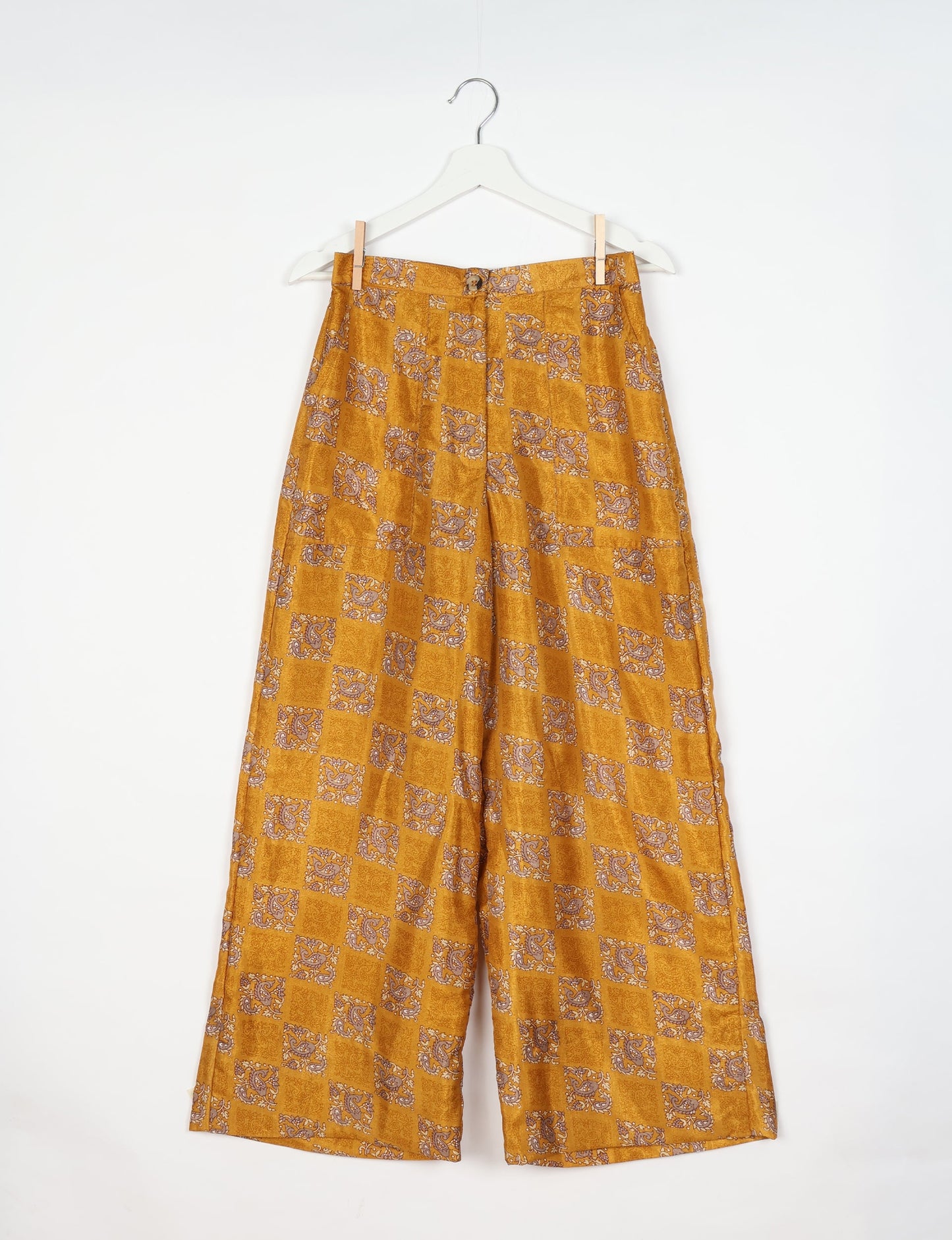 Upcycled women’s wide leg pants made from preloved saris, showcasing eco friendly clothes, zero waste clothing, and carbon neutral fashion.