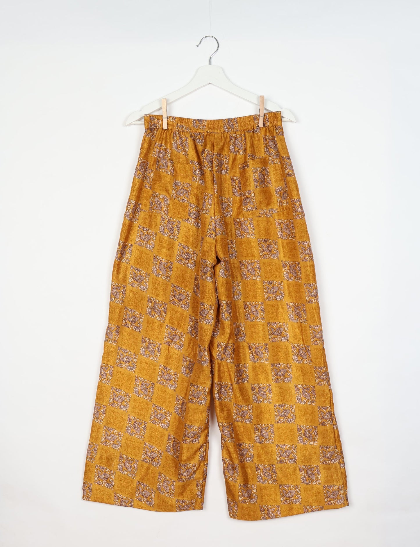Upcycled women’s wide leg pants made from preloved saris, showcasing eco friendly clothes, zero waste clothing, and carbon neutral fashion.
