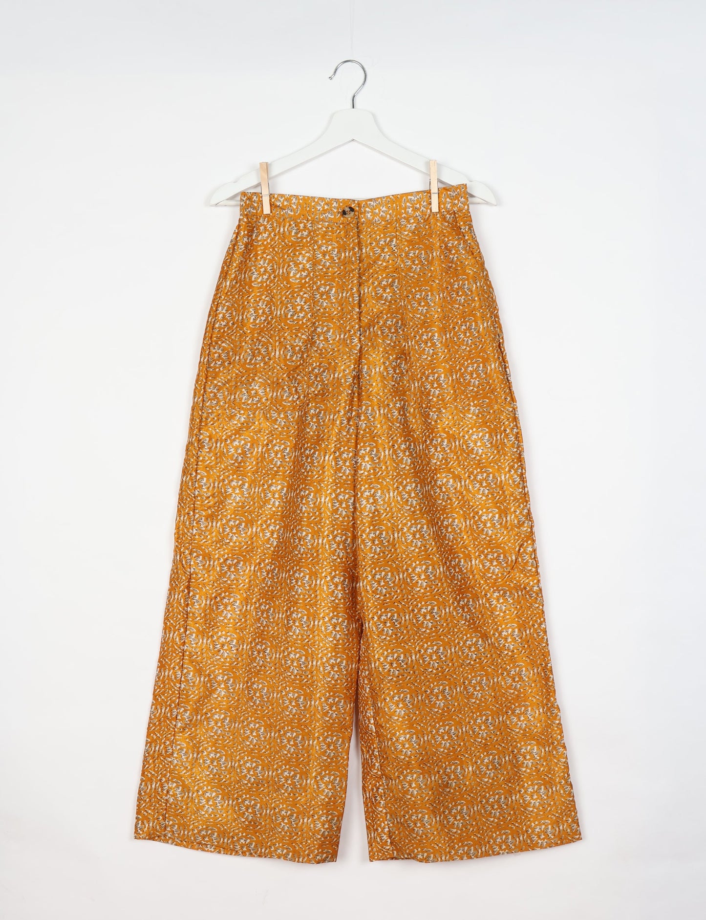 Upcycled women’s wide leg pants made from preloved saris, showcasing eco friendly clothes, zero waste clothing, and carbon neutral fashion.