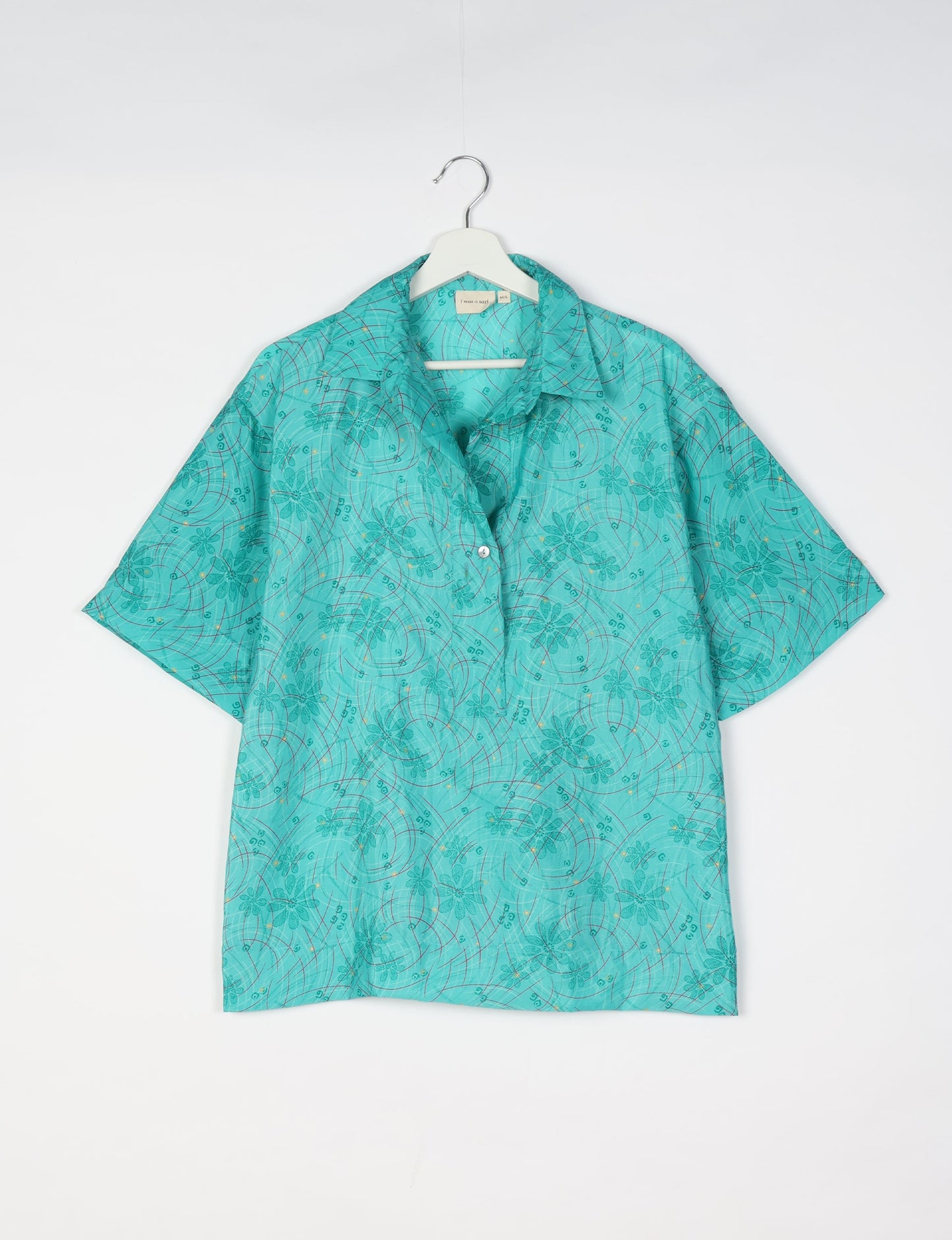 Oversized shirt made from recycled sari fabric, reflecting eco friendly fashion, repurposed clothing, and earth friendly clothing for conscious wardrobes.