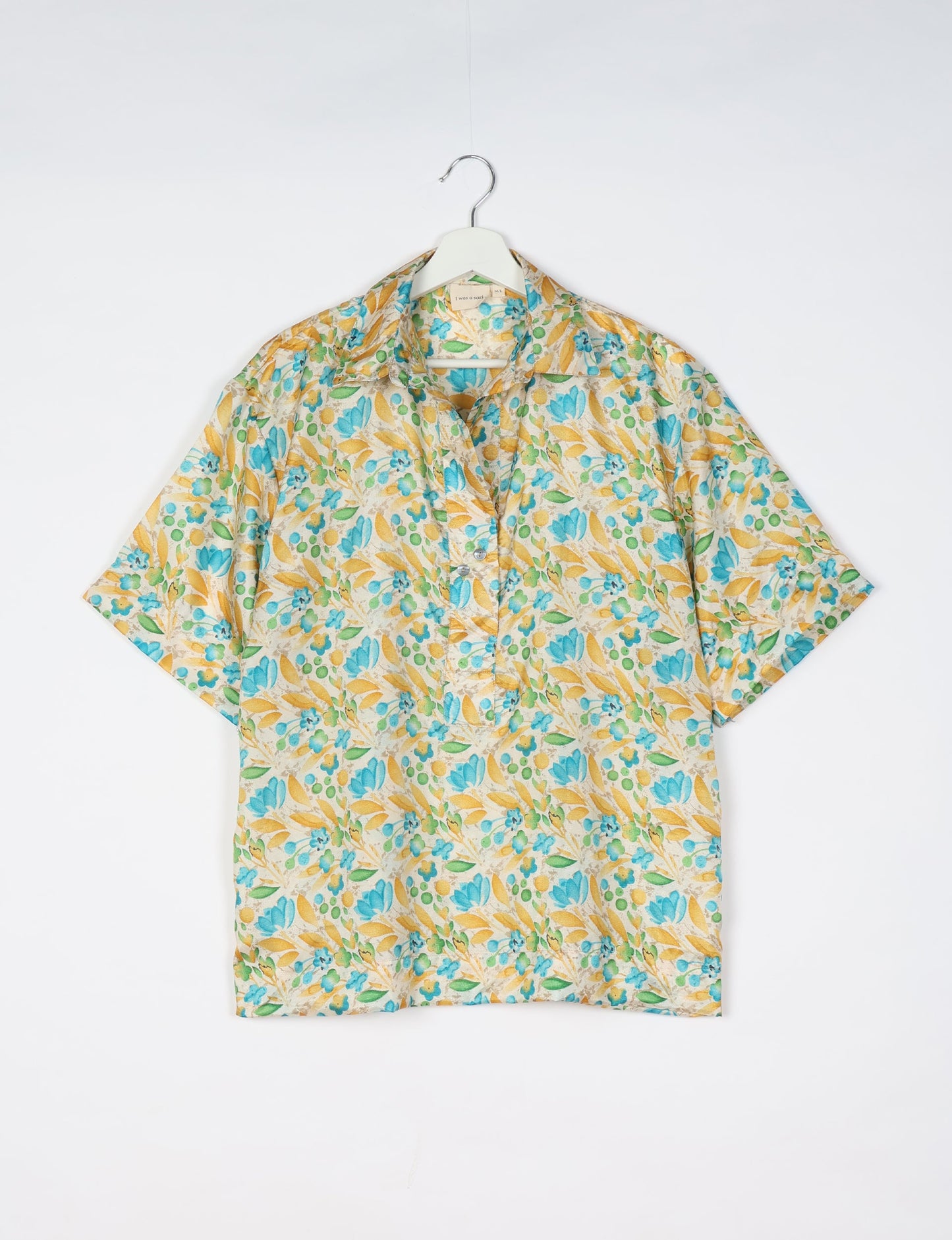 Oversized shirt made from recycled sari fabric, reflecting eco friendly fashion, repurposed clothing, and earth friendly clothing for conscious wardrobes.