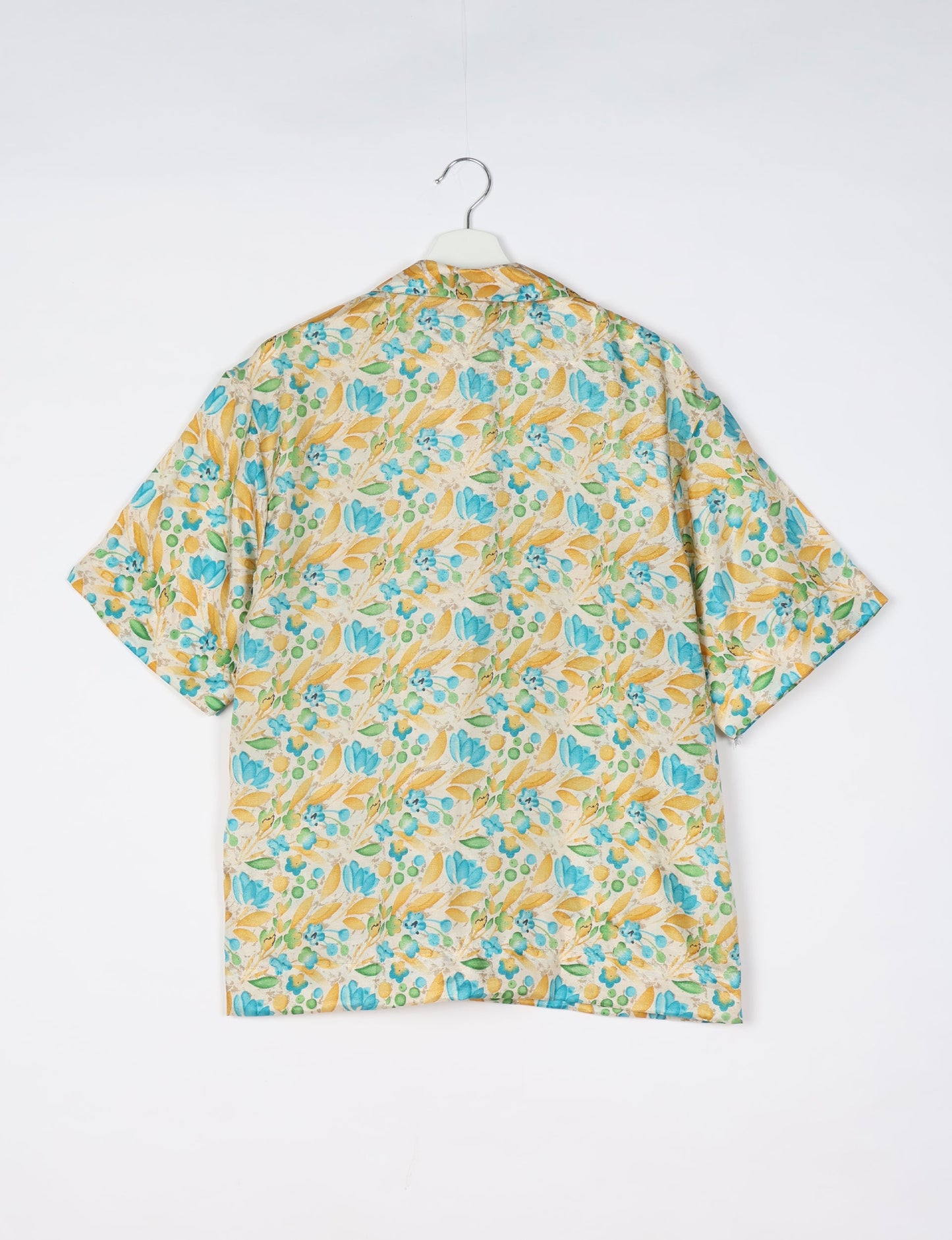 Oversized shirt made from recycled sari fabric, reflecting eco friendly fashion, repurposed clothing, and earth friendly clothing for conscious wardrobes.