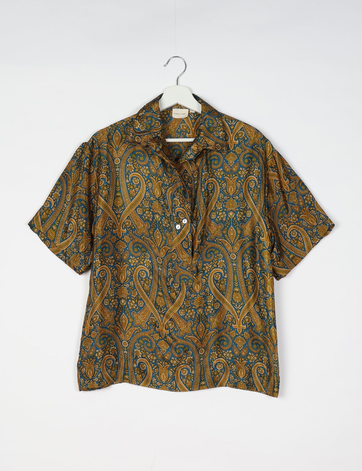 Oversized shirt made from recycled sari fabric, reflecting eco friendly fashion, repurposed clothing, and earth friendly clothing for conscious wardrobes.