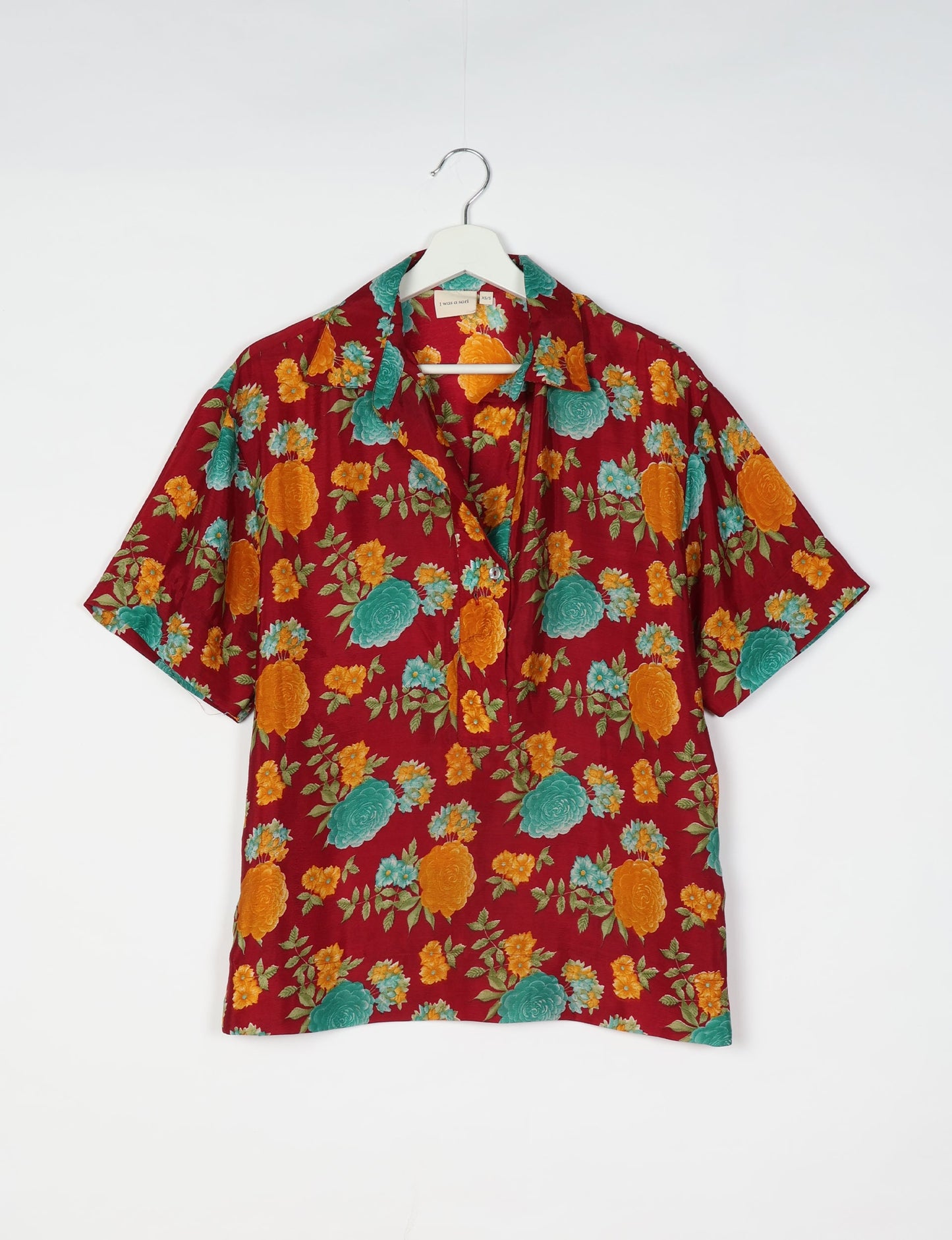 Oversized shirt made from recycled sari fabric, reflecting eco friendly fashion, repurposed clothing, and earth friendly clothing for conscious wardrobes.