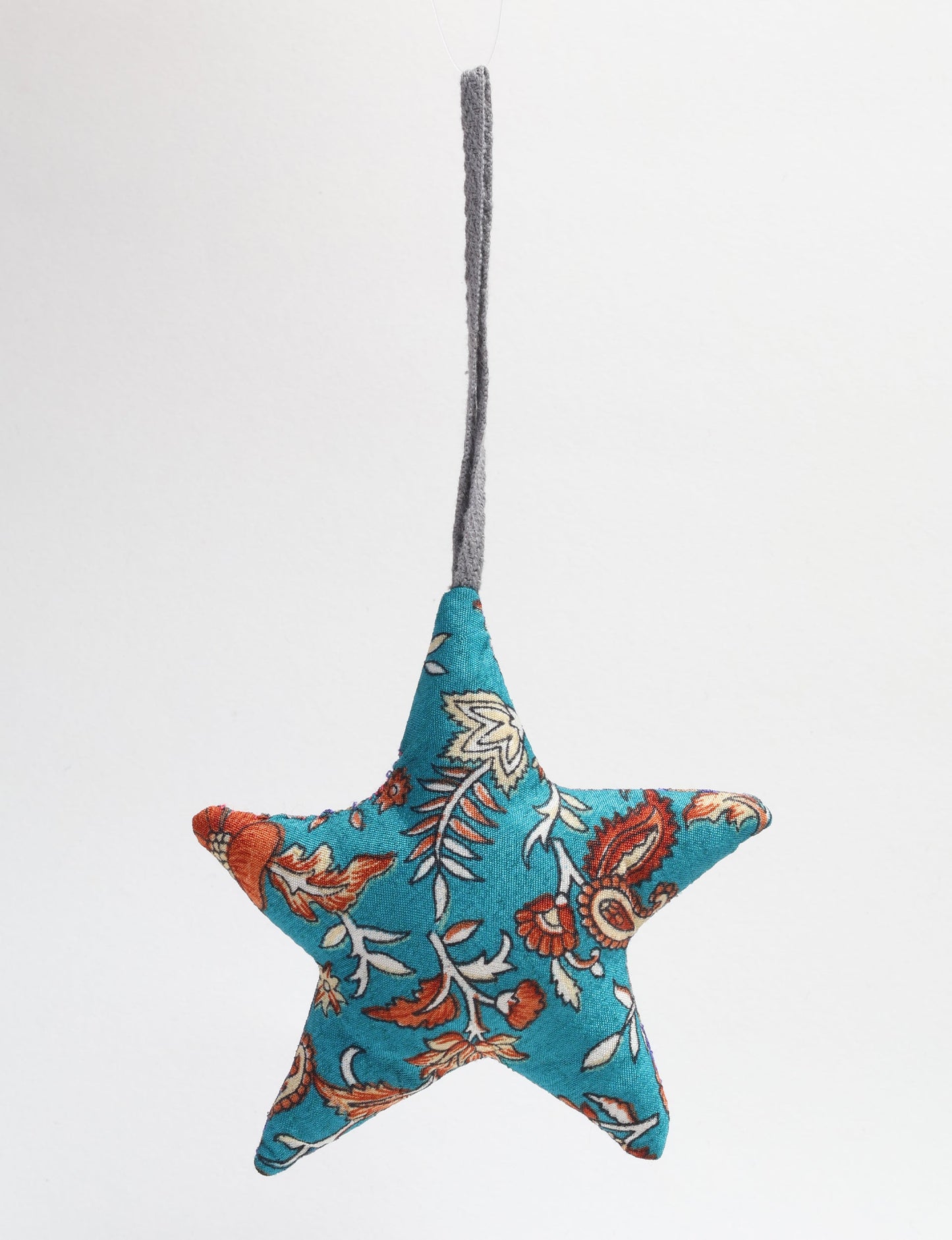 Hand-stitched mini star bauble made from recycled sari products, showcasing upcycled clothing techniques and eco friendly fashion. A lightweight festive accessory promoting conscious clothing, organic clothing, and sustainable women’s clothing crafted from recycled material clothing.