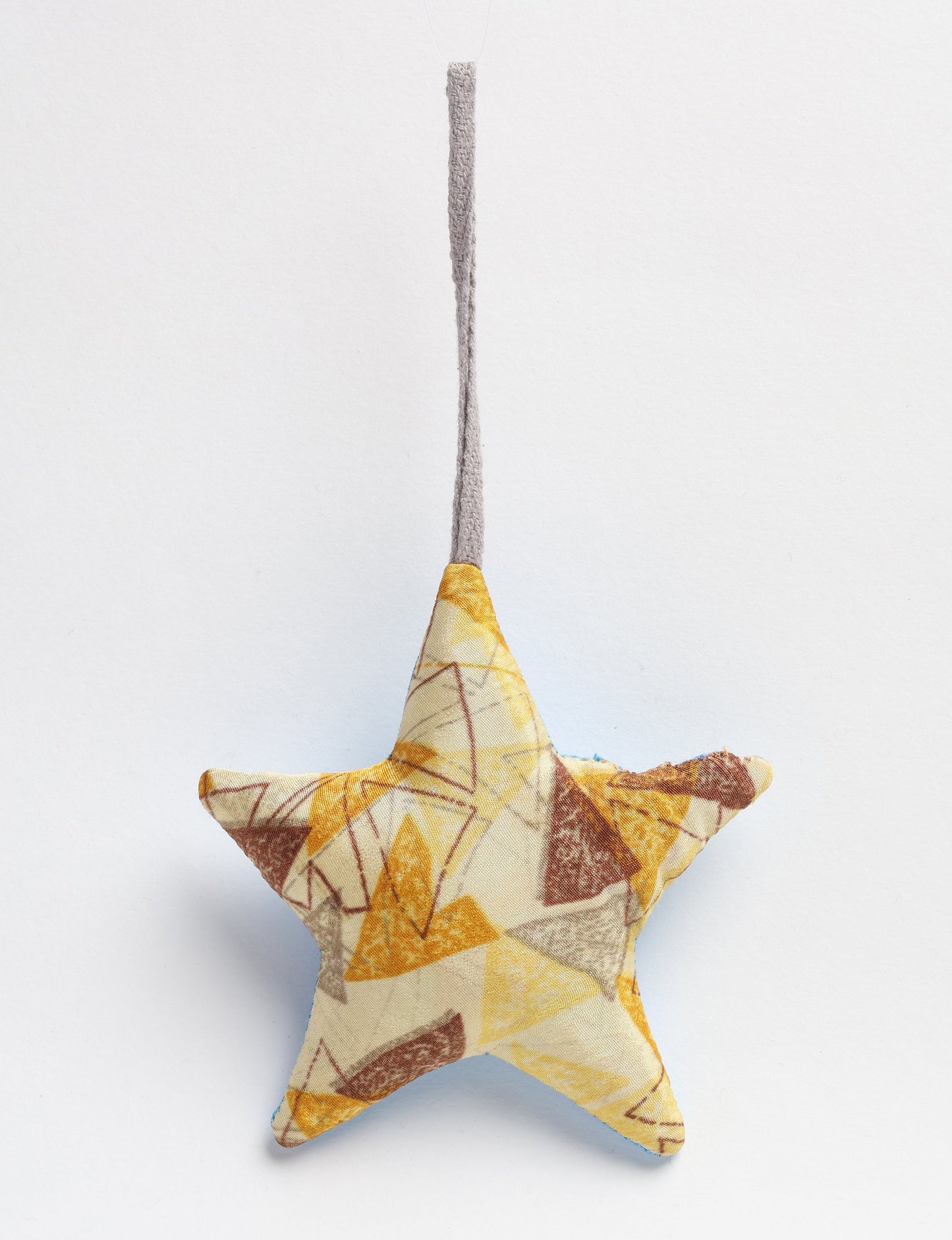 Hand-stitched mini star bauble made from recycled sari products, showcasing upcycled clothing techniques and eco friendly fashion. A lightweight festive accessory promoting conscious clothing, organic clothing, and sustainable women’s clothing crafted from recycled material clothing.