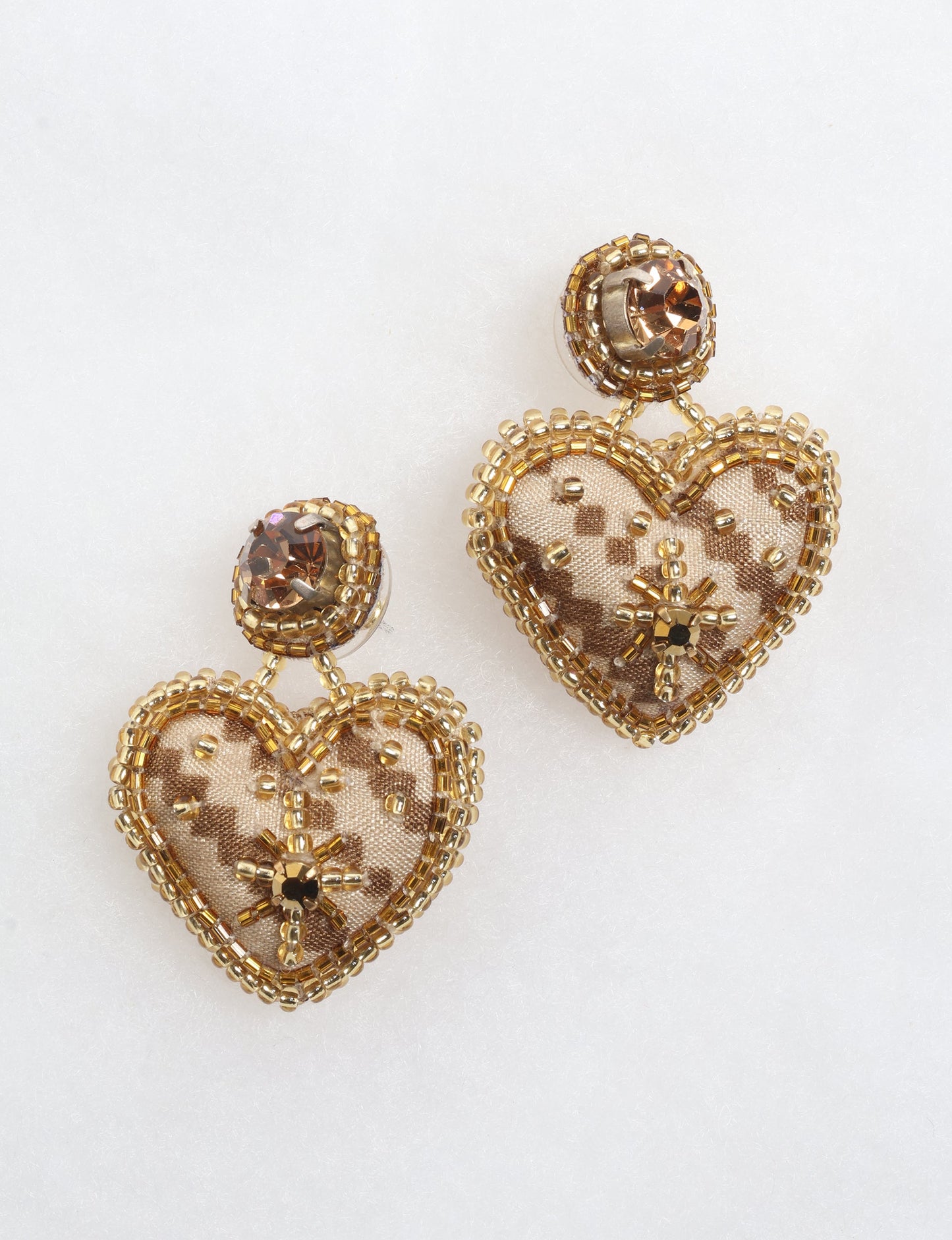 Hand-embroidered Heart Drop Earrings featuring intricate Aari stitching, crafted from recycled sari fabric. A stunning blend of upcycled clothing, ethical fashion, and circular fashion, these earrings embrace recycled sustainable fashion and earth-friendly clothing for a truly elegant, eco-conscious choice.