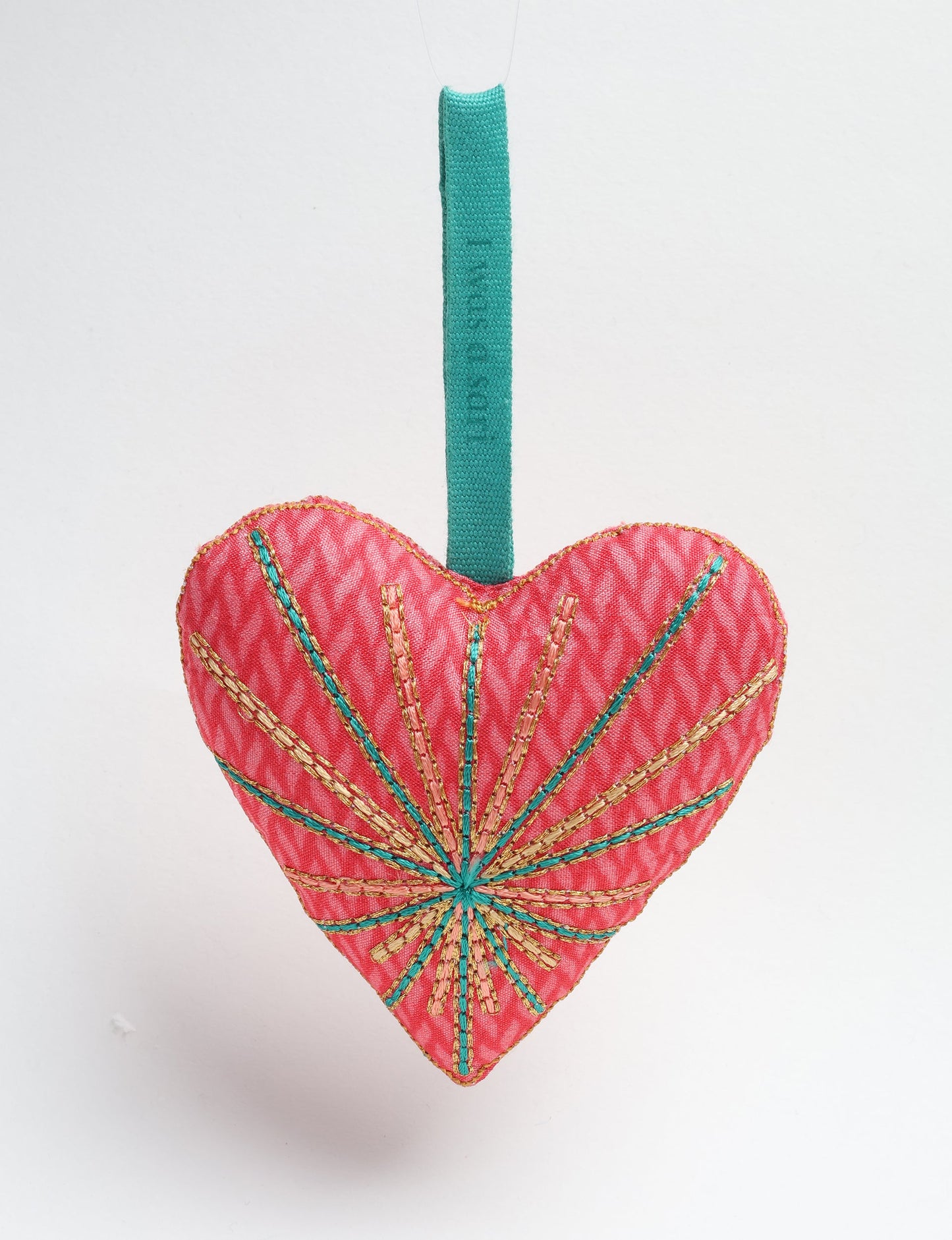 Timeless Heart ornament made from upcycled clothing and recycled fabric, filled with organic cotton and hand-finished with vibrant silk and metallic thread. An eco-friendly, carbon neutral fashion piece that supports green fashion and fair trade apparel.