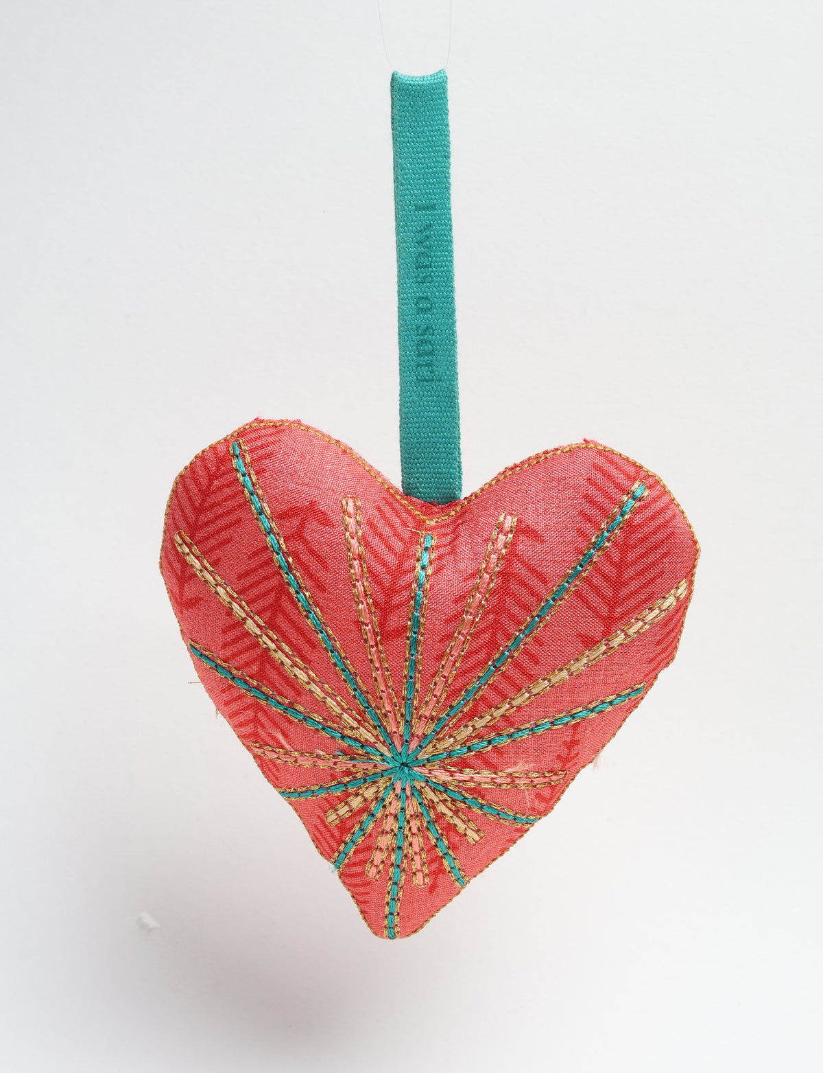 Timeless Heart ornament made from upcycled clothing and recycled fabric, filled with organic cotton and hand-finished with vibrant silk and metallic thread. An eco-friendly, carbon neutral fashion piece that supports green fashion and fair trade apparel.