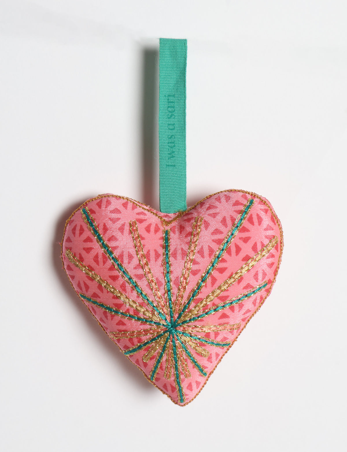 Timeless Heart ornament made from upcycled clothing and recycled fabric, filled with organic cotton and hand-finished with vibrant silk and metallic thread. An eco-friendly, carbon neutral fashion piece that supports green fashion and fair trade apparel.