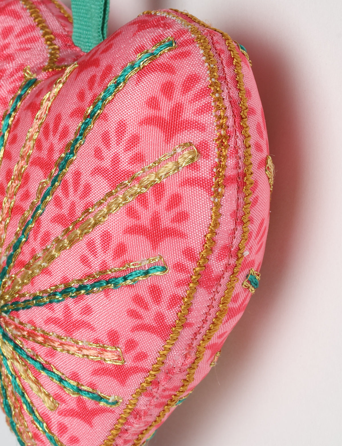 Timeless Heart ornament made from upcycled clothing and recycled fabric, filled with organic cotton and hand-finished with vibrant silk and metallic thread. An eco-friendly, carbon neutral fashion piece that supports green fashion and fair trade apparel.