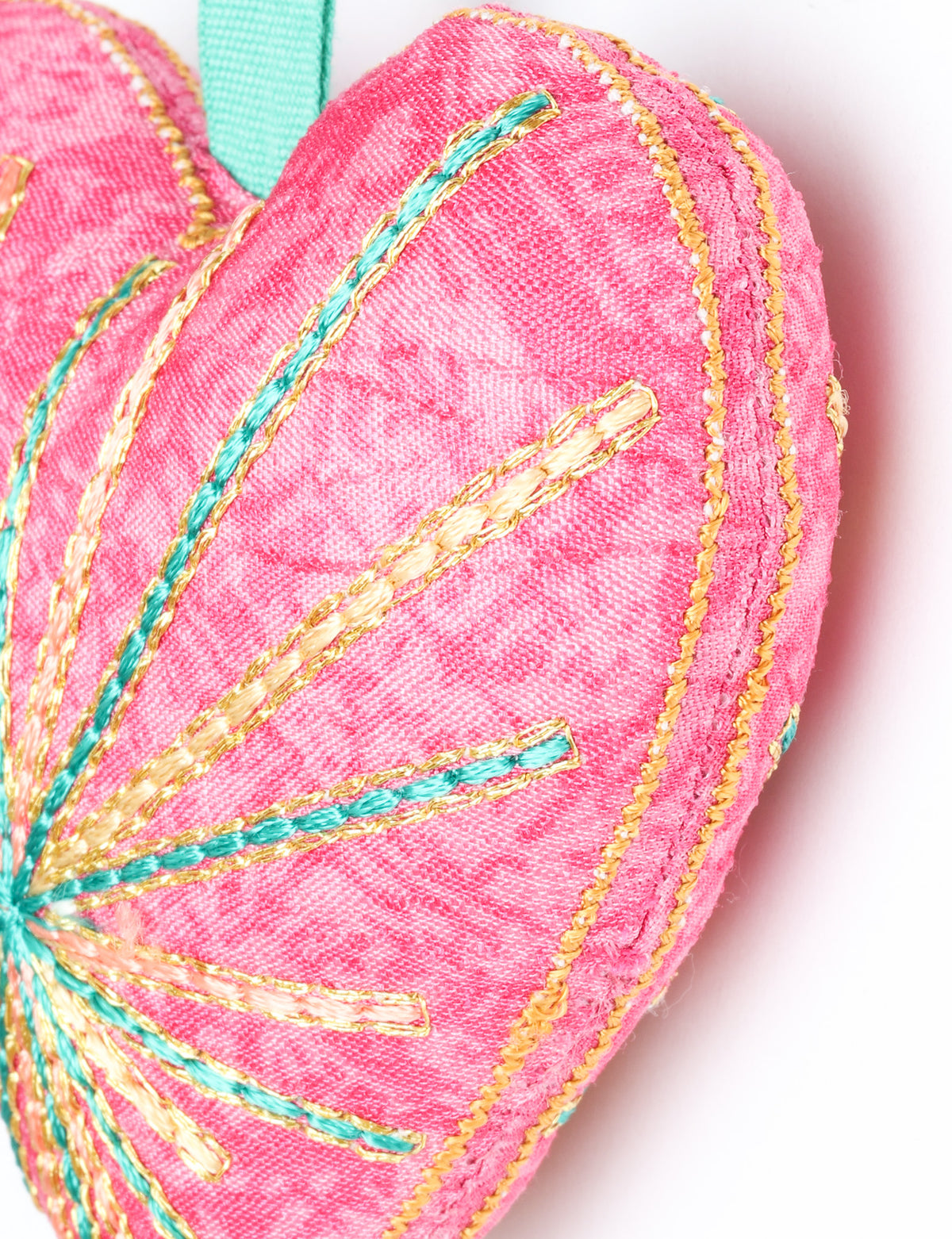 Timeless Heart ornament made from upcycled clothing and recycled fabric, filled with organic cotton and hand-finished with vibrant silk and metallic thread. An eco-friendly, carbon neutral fashion piece that supports green fashion and fair trade apparel.
