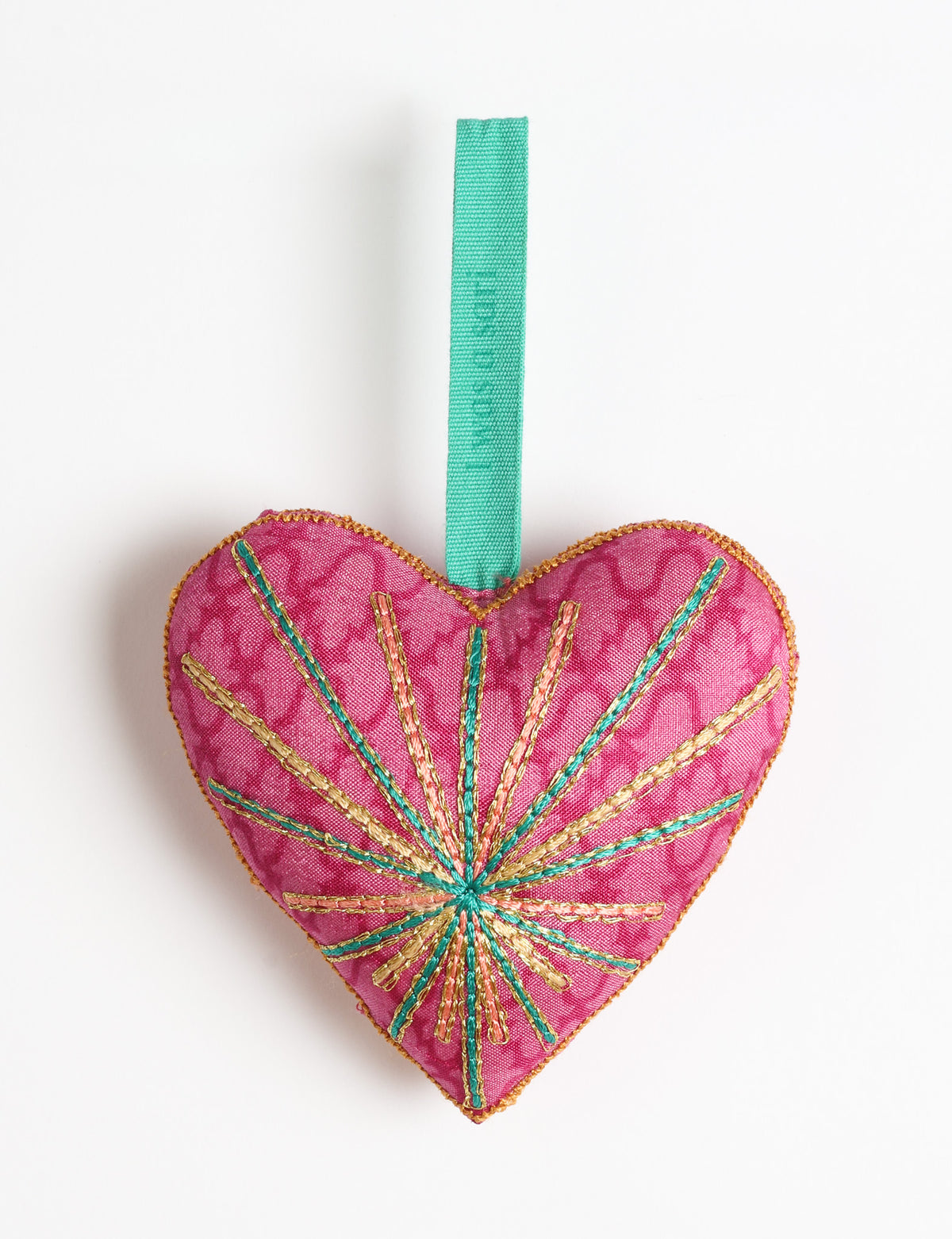 Timeless Heart ornament made from upcycled clothing and recycled fabric, filled with organic cotton and hand-finished with vibrant silk and metallic thread. An eco-friendly, carbon neutral fashion piece that supports green fashion and fair trade apparel.