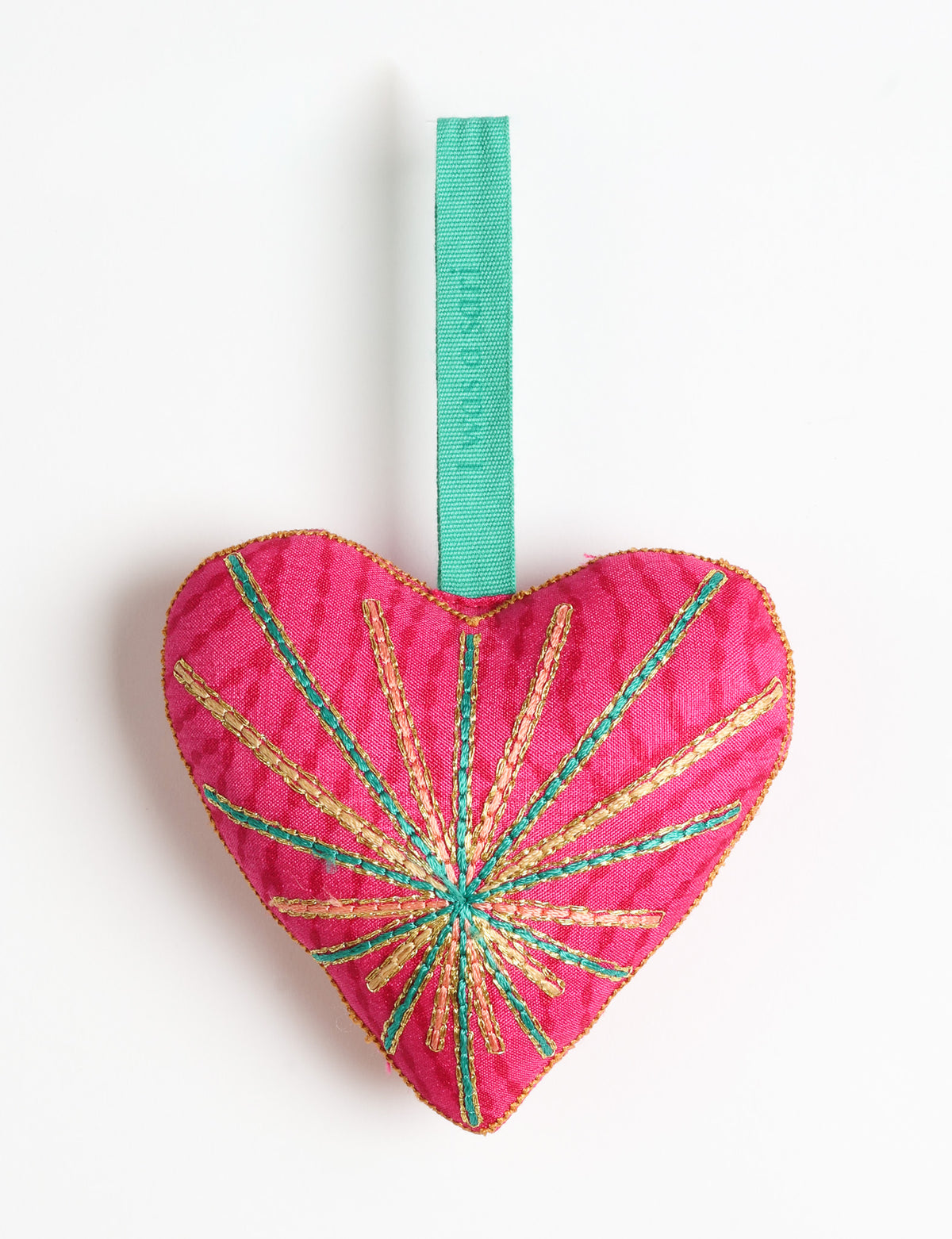Timeless Heart ornament made from upcycled clothing and recycled fabric, filled with organic cotton and hand-finished with vibrant silk and metallic thread. An eco-friendly, carbon neutral fashion piece that supports green fashion and fair trade apparel.