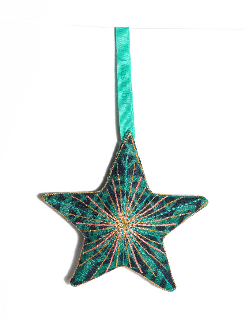 Timeless star ornament made from recycled sari fabric, featuring silk and metallic embroidery, crafted as part of green fashion, recycled clothing design, environmentally friendly clothing practices, and repurposed clothing traditions.