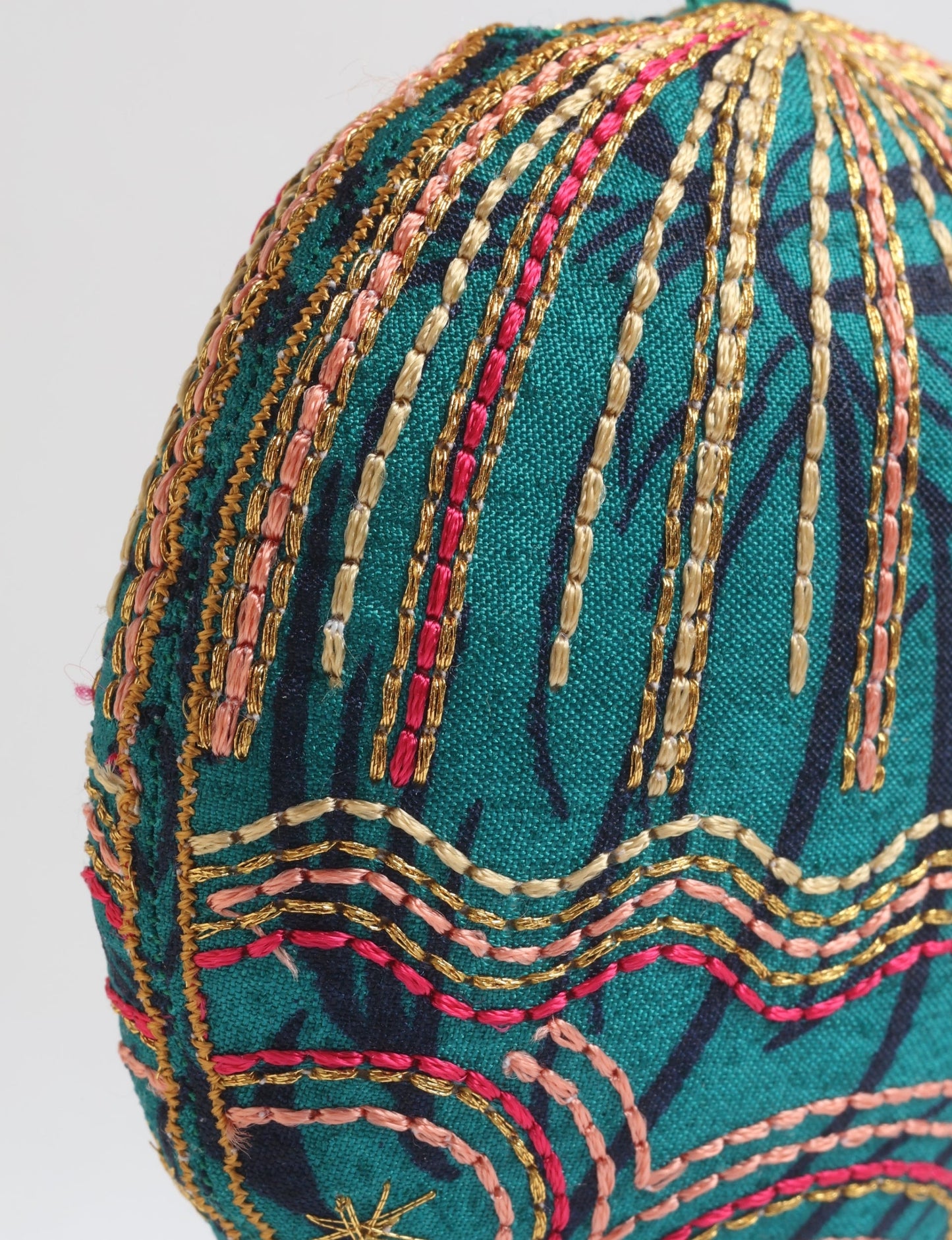 Timeless Full Moon ornament handmade from recycled sari fabric, featuring organic cotton filling and gold thread embroidery — a beautiful piece of upcycled clothing, eco clothing, and sustainable women’s fashion made from repurposed materials.