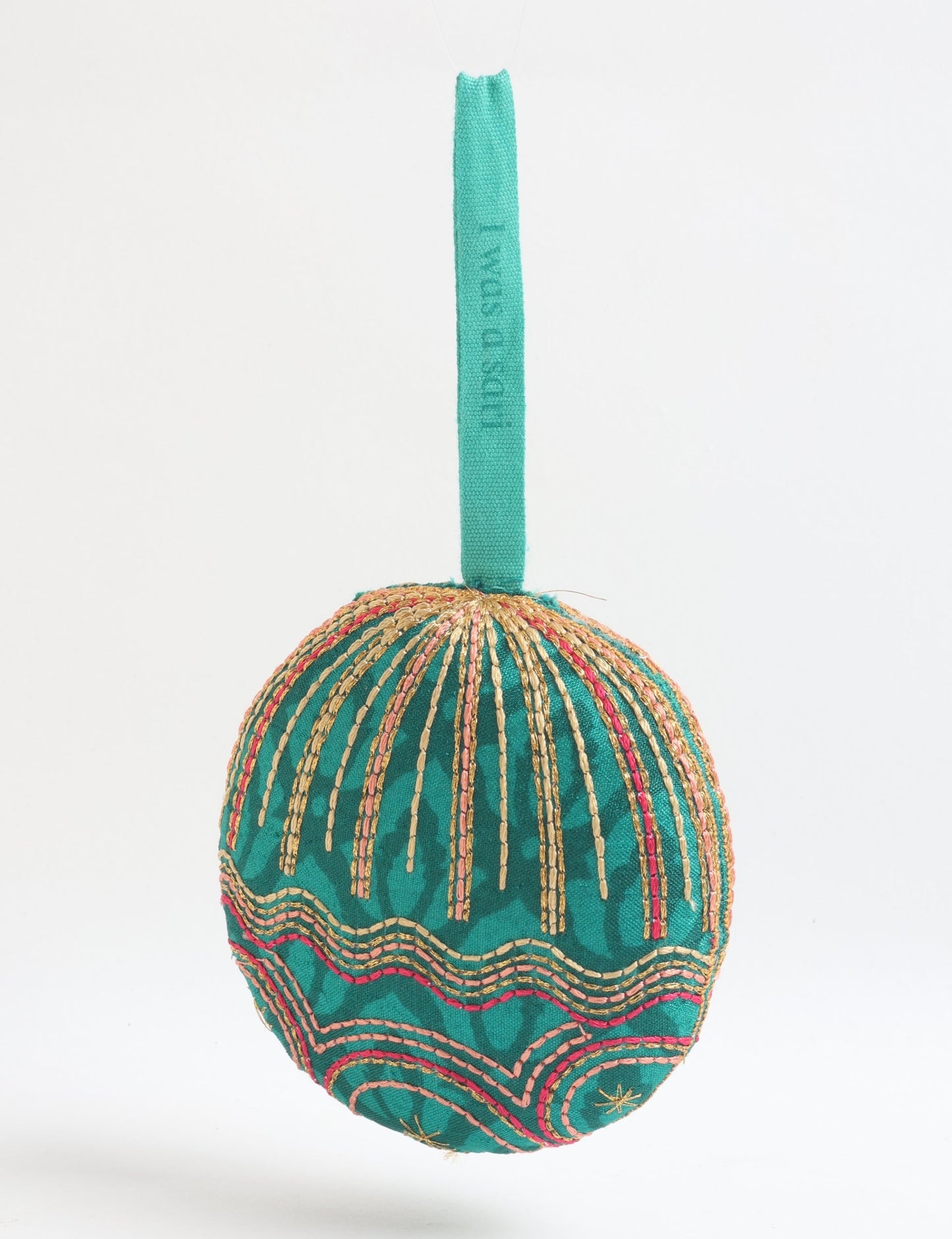 Timeless Full Moon ornament handmade from recycled sari fabric, featuring organic cotton filling and gold thread embroidery — a beautiful piece of upcycled clothing, eco clothing, and sustainable women’s fashion made from repurposed materials.