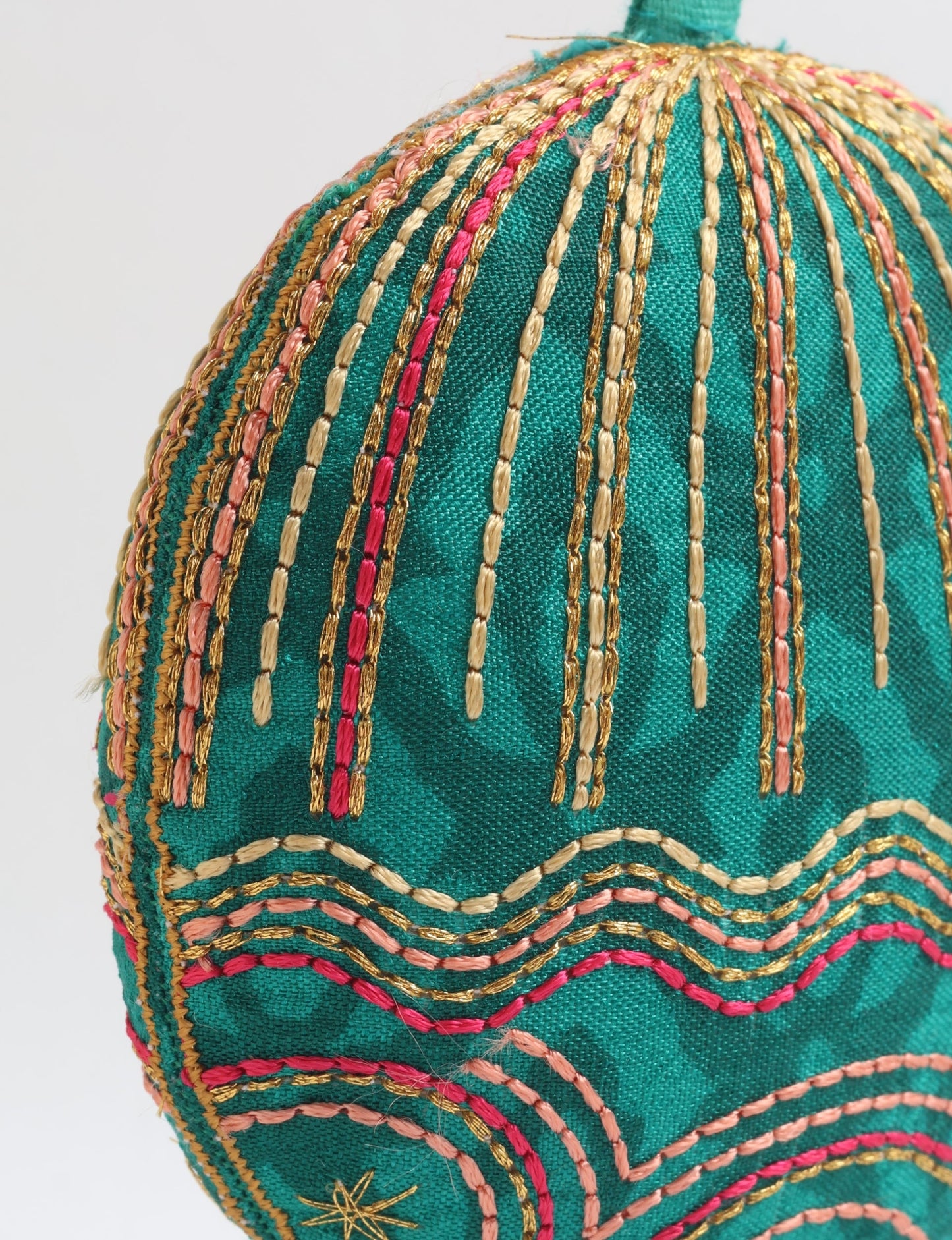 Timeless Full Moon ornament handmade from recycled sari fabric, featuring organic cotton filling and gold thread embroidery — a beautiful piece of upcycled clothing, eco clothing, and sustainable women’s fashion made from repurposed materials.