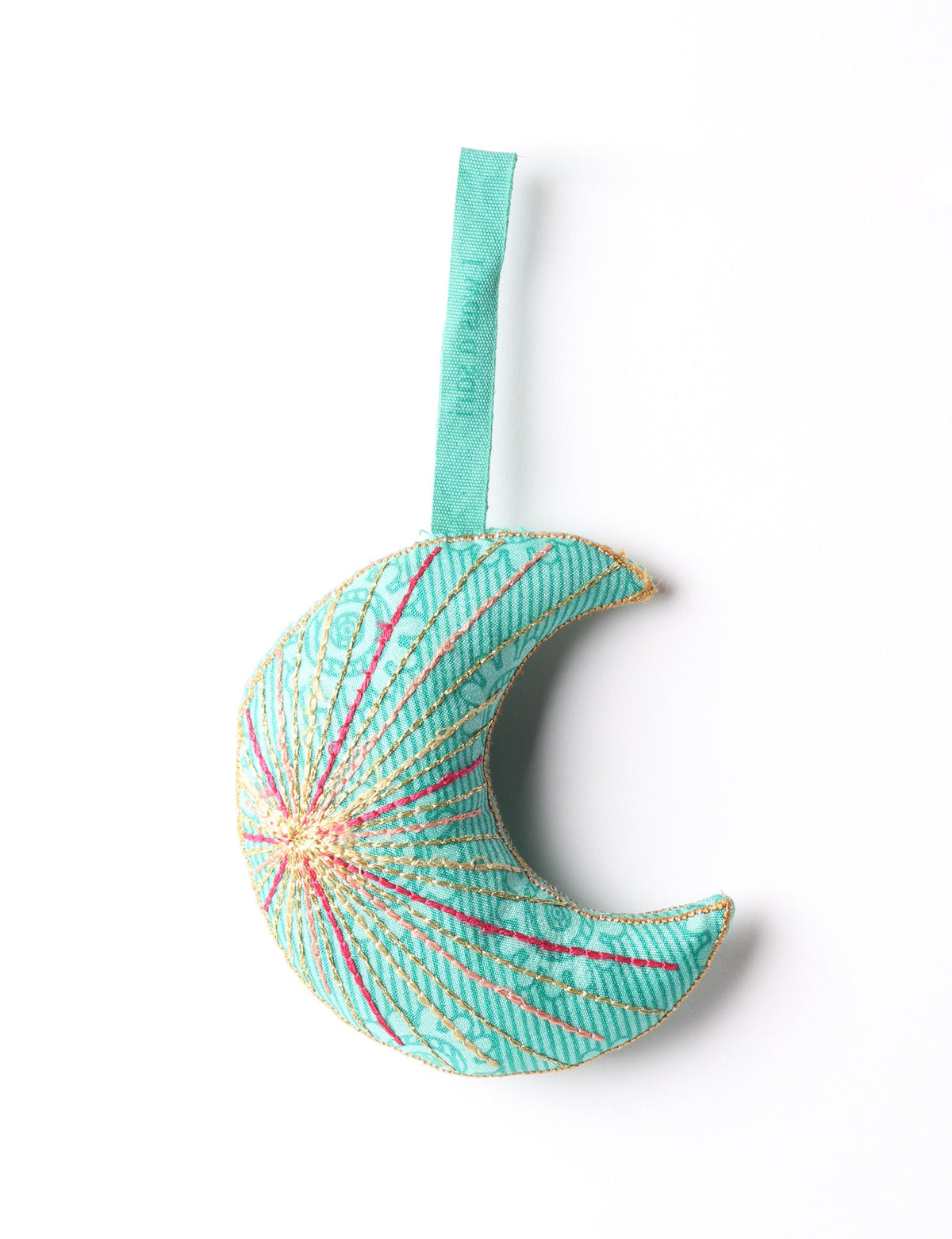 Blue fabric crescent moon ornament with multicolored stitched lines and a matching blue hanging loop against white background