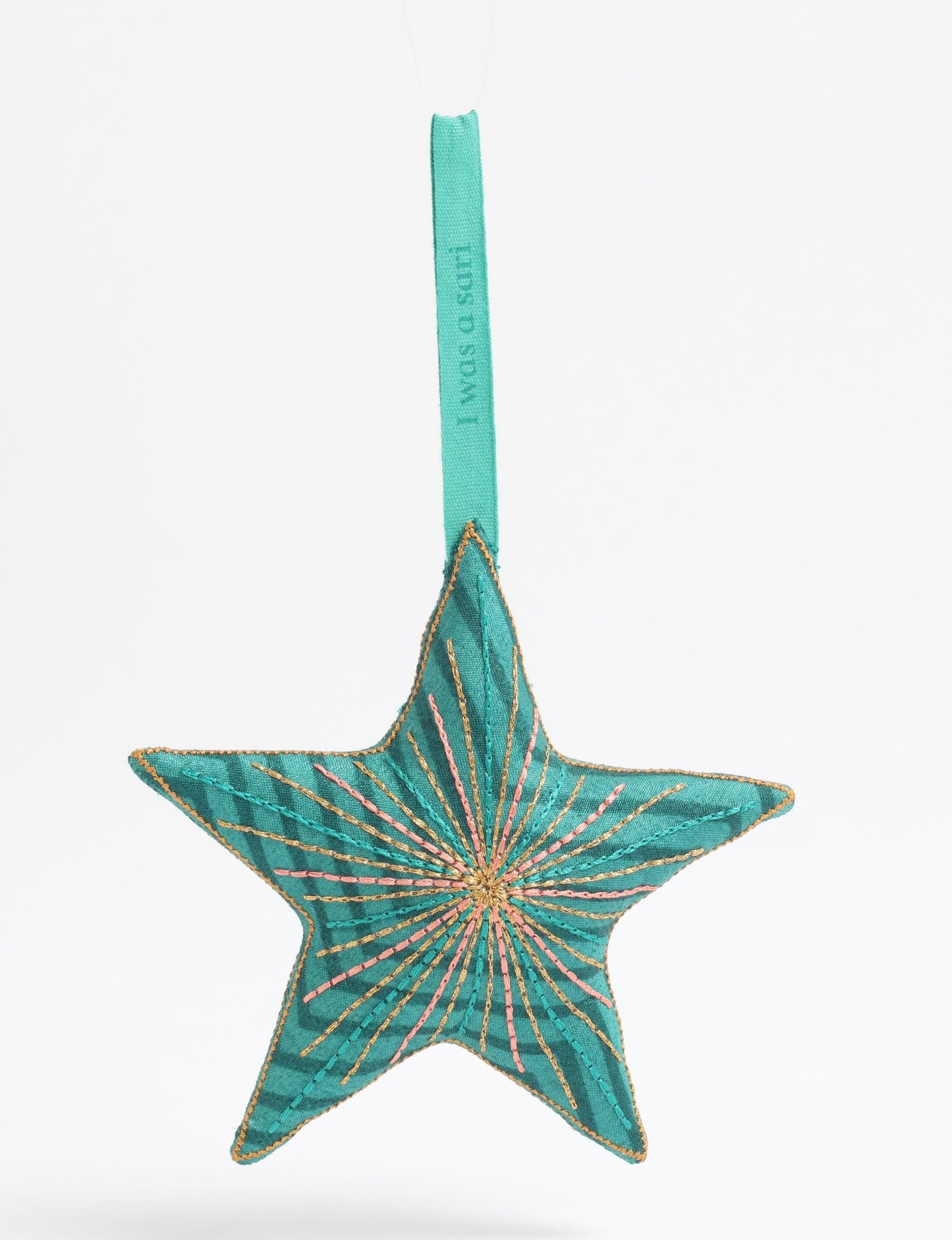 Timeless star ornament made from recycled sari fabric, featuring silk and metallic embroidery, crafted as part of green fashion, recycled clothing design, environmentally friendly clothing practices, and repurposed clothing traditions.