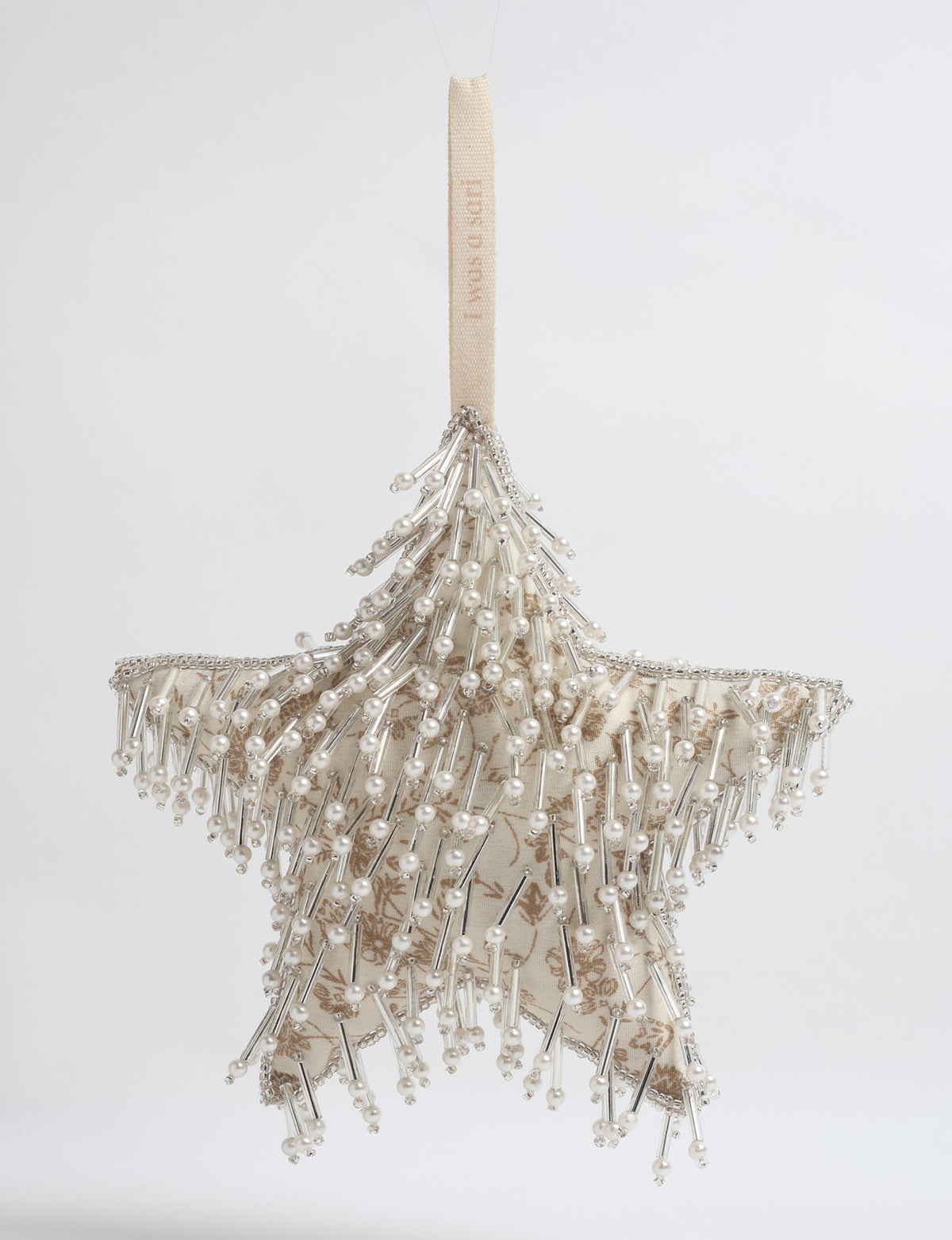 Beige fabric star ornament with silver beads and pearls, hanging by a beige loop with text "I was a star"