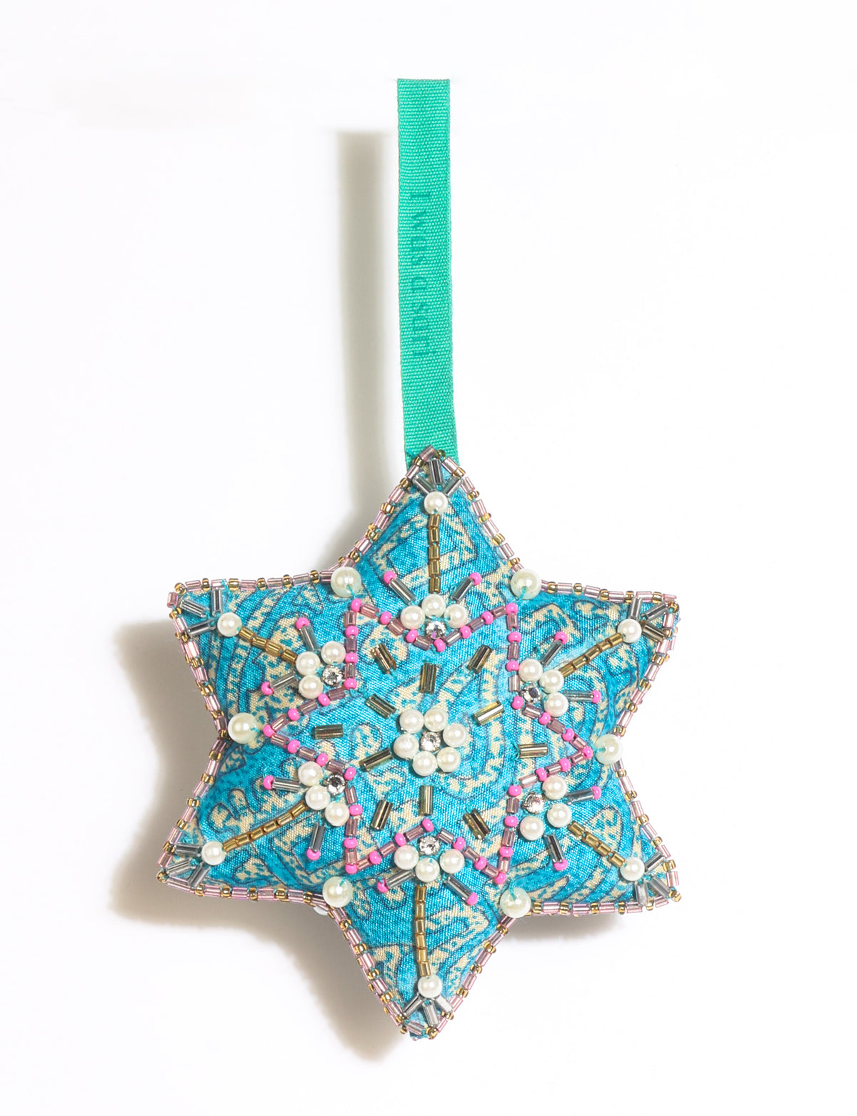 Teal fabric star-shaped snowflake ornament with bead and pearl embellishments, hanging by a teal fabric loop