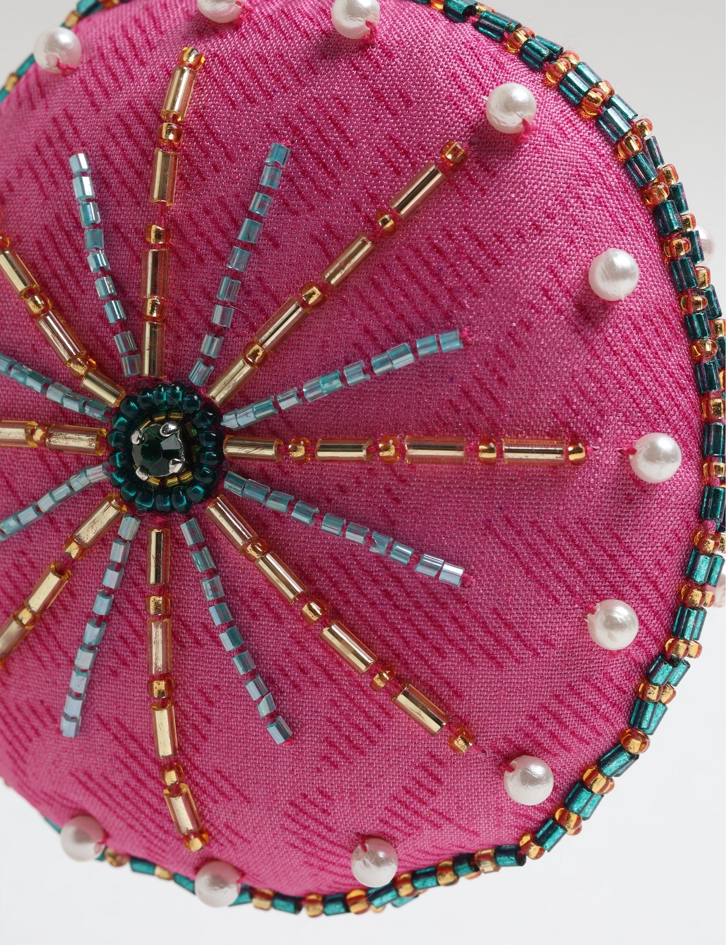 Handcrafted full moon ornament made from recycled sari fabric and embroidered with beads — an example of upcycled clothing and slow fashion, promoting eco clothing, recycled fashion, and conscious clothing practices.