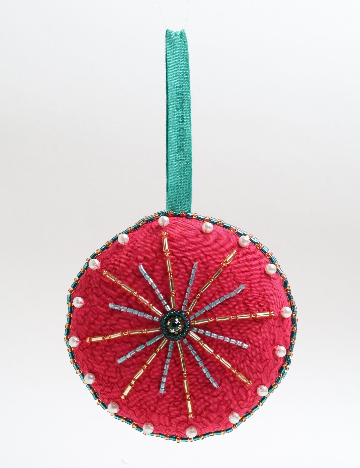 Handcrafted full moon ornament made from recycled sari fabric and embroidered with beads — an example of upcycled clothing and slow fashion, promoting eco clothing, recycled fashion, and conscious clothing practices.