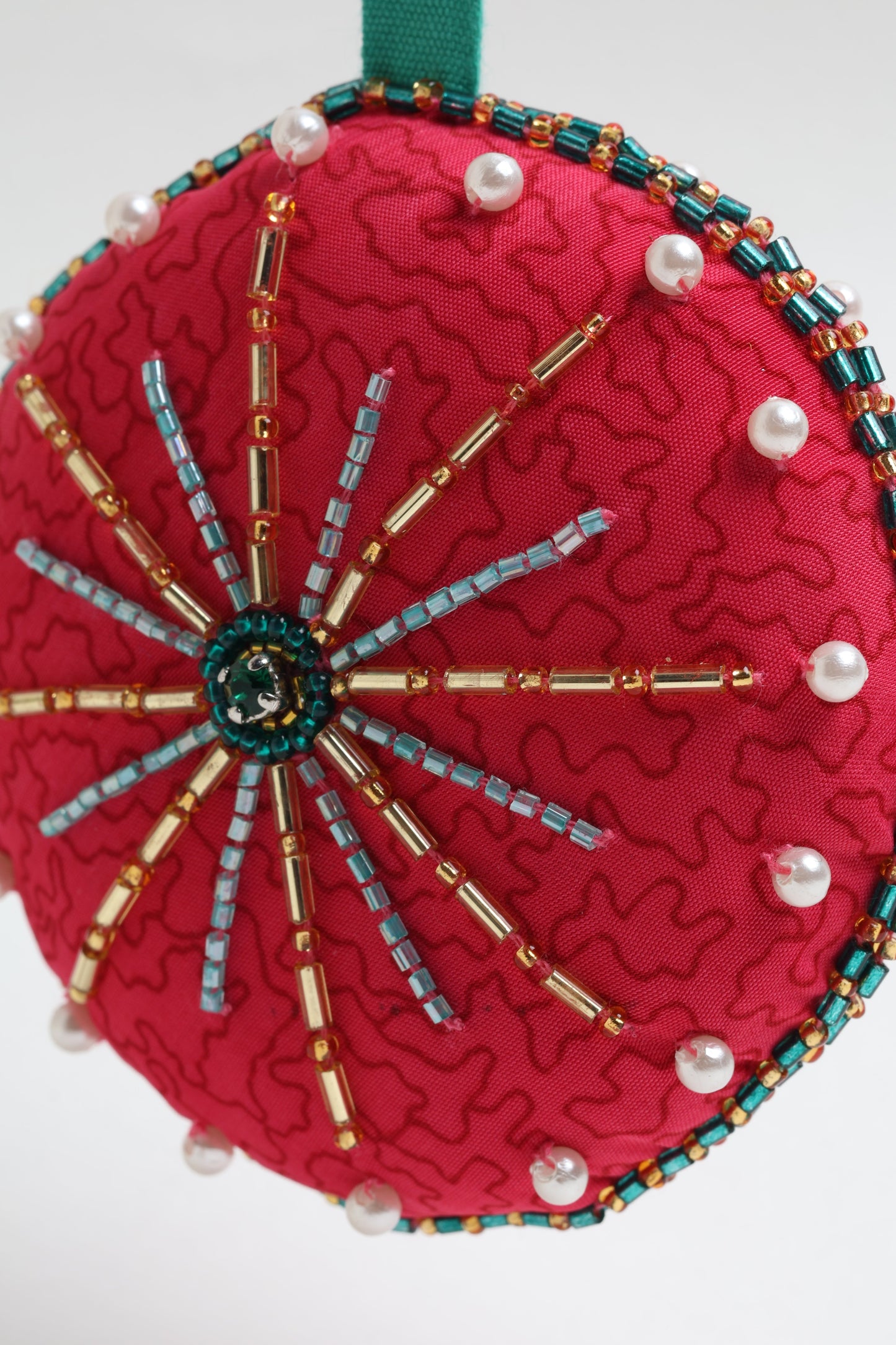 Handcrafted full moon ornament made from recycled sari fabric and embroidered with beads — an example of upcycled clothing and slow fashion, promoting eco clothing, recycled fashion, and conscious clothing practices.