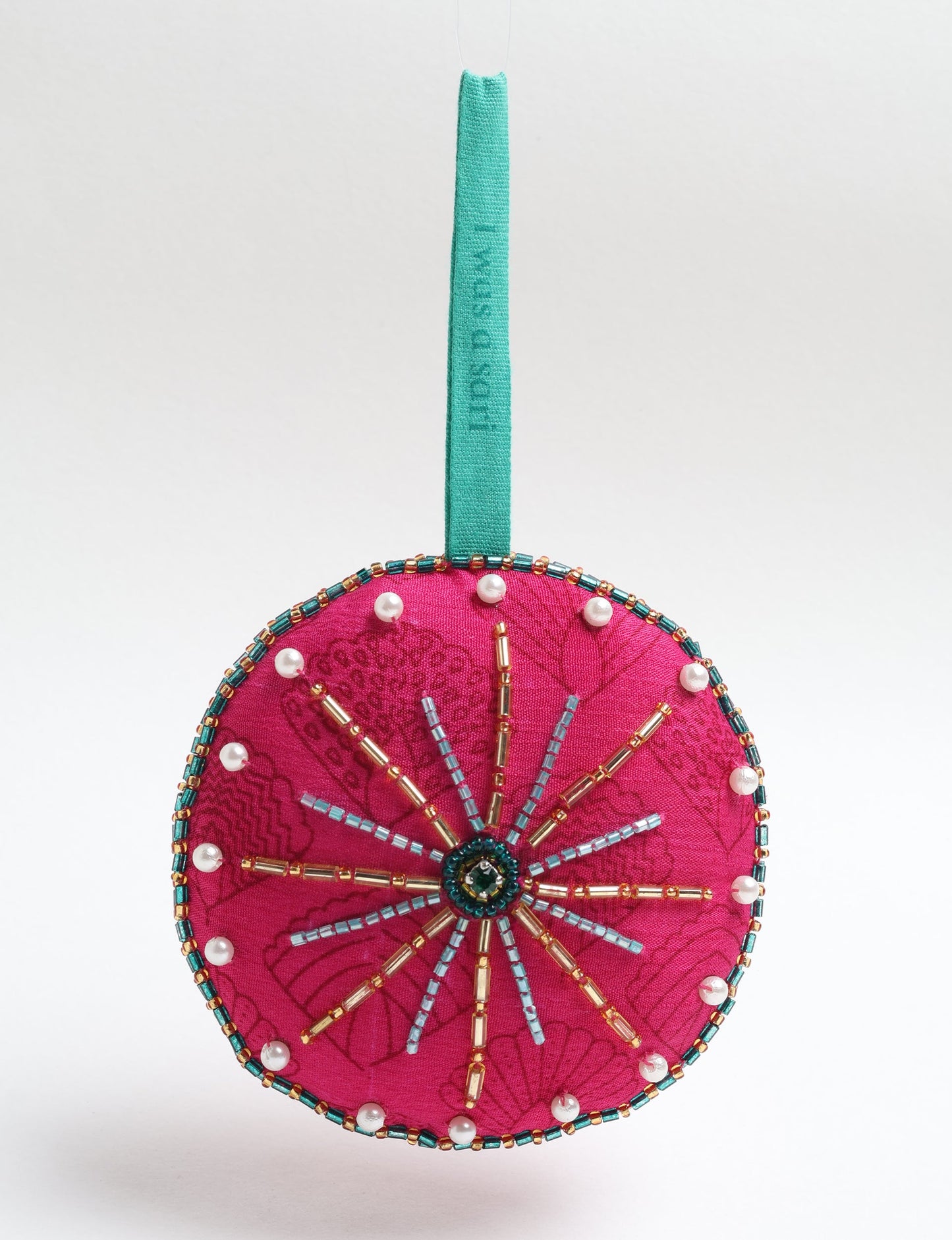 Handcrafted full moon ornament made from recycled sari fabric and embroidered with beads — an example of upcycled clothing and slow fashion, promoting eco clothing, recycled fashion, and conscious clothing practices.