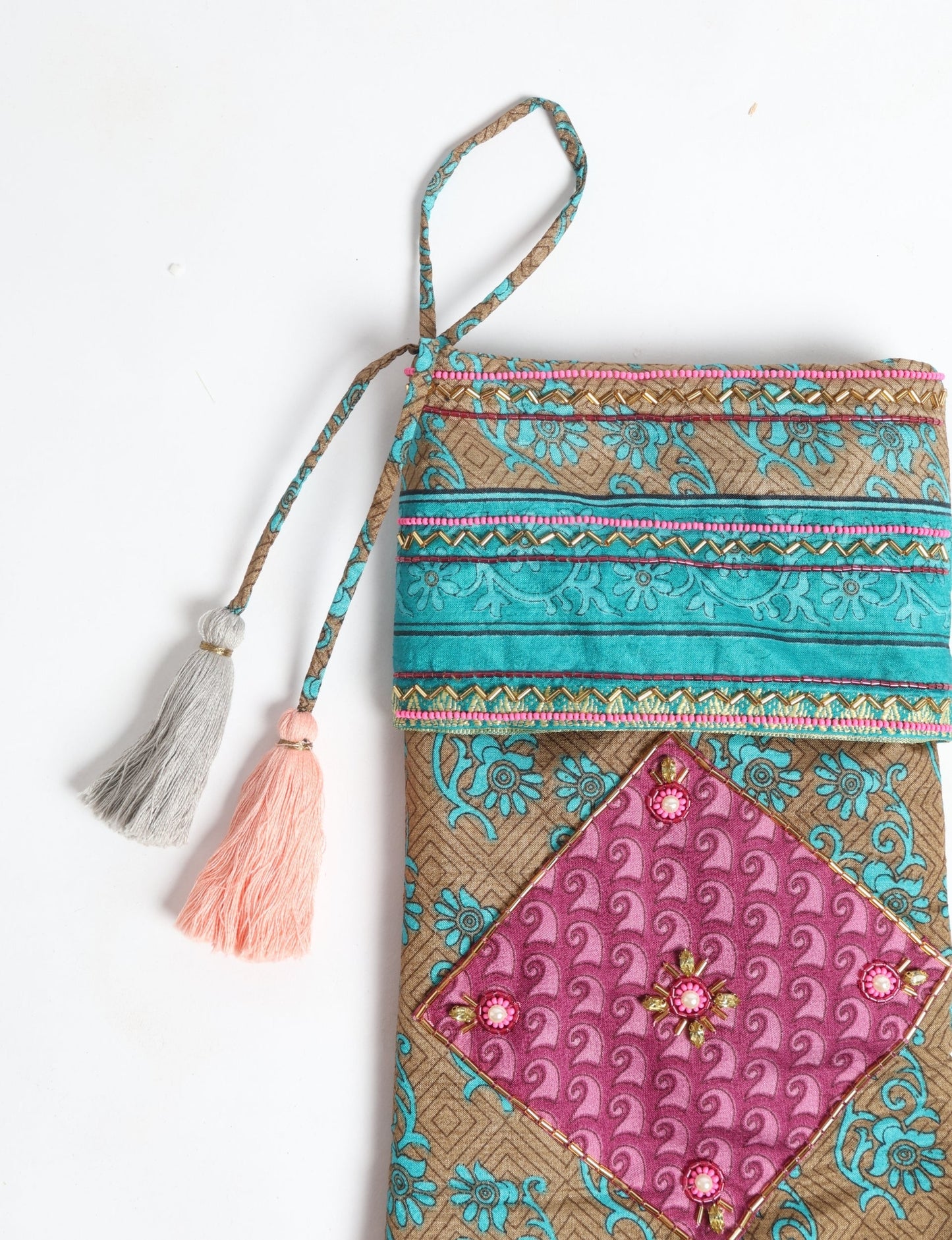 Cheer Christmas stocking made from recycled sari fabric with patchwork, gold hand embroidery, stones, sequins, pearls, glass beads, heart charm, and tassel — upcycled women’s clothing, conscious clothing, green fashion, upcycling fashion, environmentally friendly clothing, products made from textile waste, repurposed clothing, carbon neutral fashion, eco clothing, natural clothing.