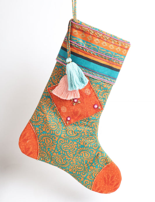 Cheer Christmas stocking made from recycled sari fabric with patchwork, gold hand embroidery, stones, sequins, pearls, glass beads, heart charm, and tassel — upcycled women’s clothing, conscious clothing, green fashion, upcycling fashion, environmentally friendly clothing, products made from textile waste, repurposed clothing, carbon neutral fashion, eco clothing, natural clothing.