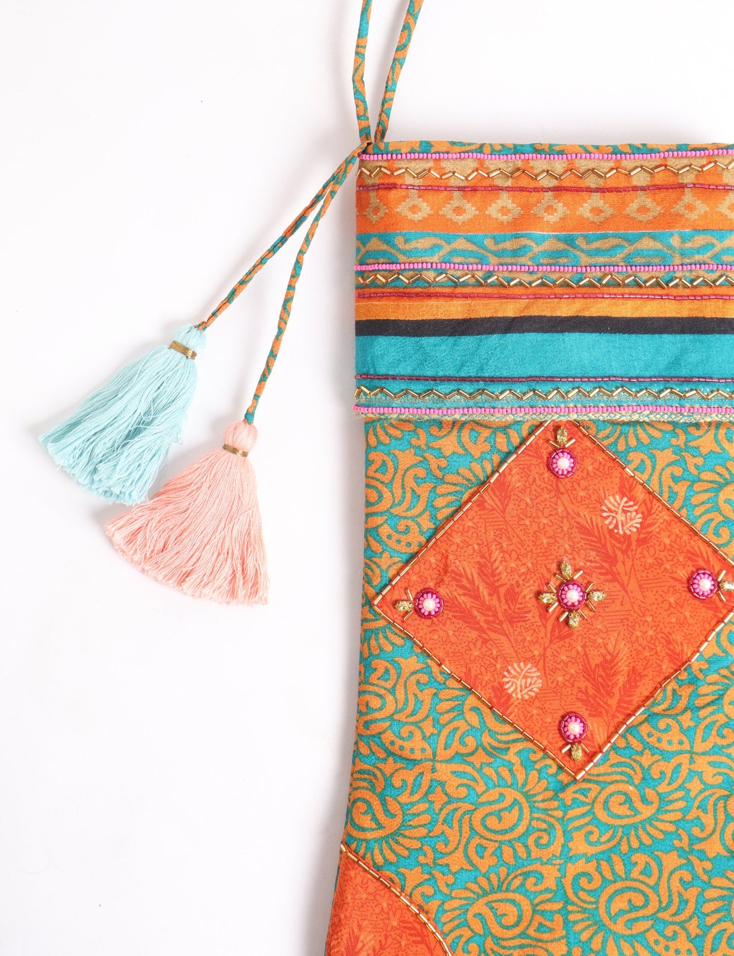 Cheer Christmas stocking made from recycled sari fabric with patchwork, gold hand embroidery, stones, sequins, pearls, glass beads, heart charm, and tassel — upcycled women’s clothing, conscious clothing, green fashion, upcycling fashion, environmentally friendly clothing, products made from textile waste, repurposed clothing, carbon neutral fashion, eco clothing, natural clothing.