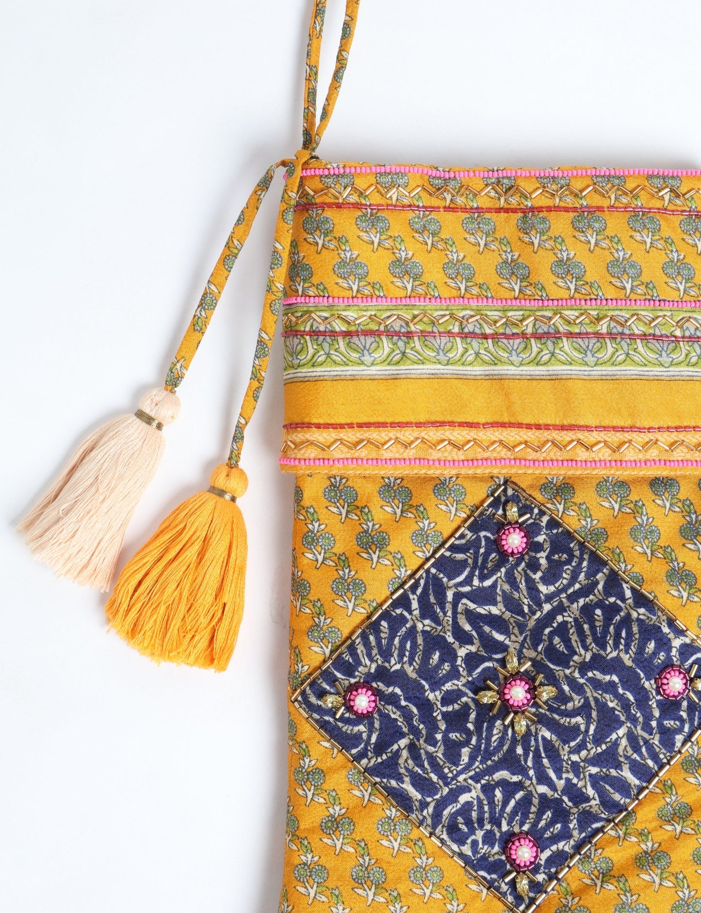 Cheer Christmas stocking made from recycled sari fabric with patchwork, gold hand embroidery, stones, sequins, pearls, glass beads, heart charm, and tassel — upcycled women’s clothing, conscious clothing, green fashion, upcycling fashion, environmentally friendly clothing, products made from textile waste, repurposed clothing, carbon neutral fashion, eco clothing, natural clothing.