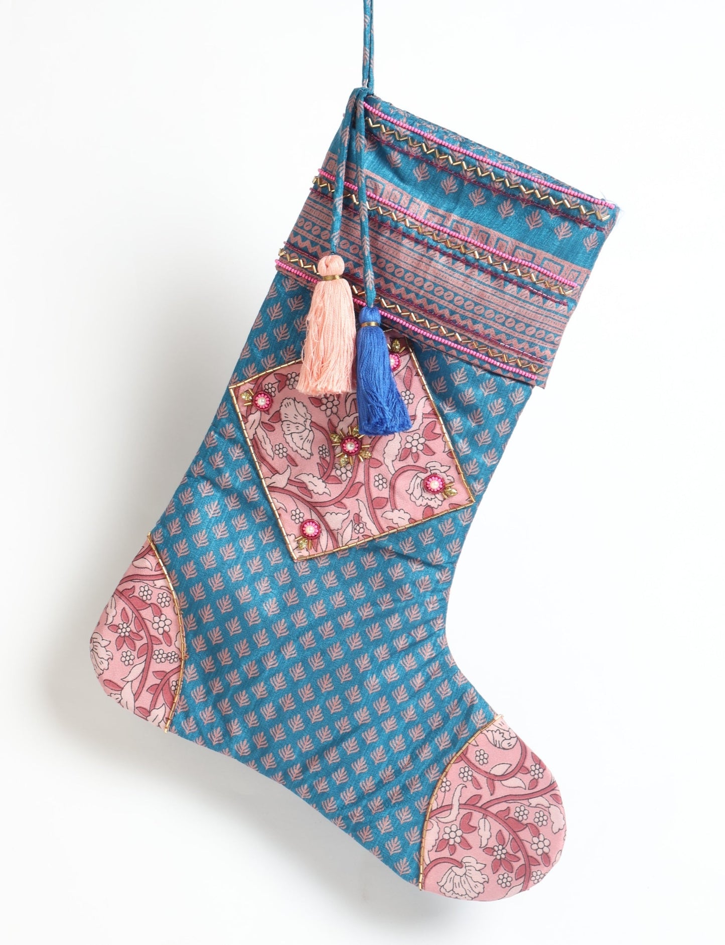 Cheer Christmas stocking made from recycled sari fabric with patchwork, gold hand embroidery, stones, sequins, pearls, glass beads, heart charm, and tassel — upcycled women’s clothing, conscious clothing, green fashion, upcycling fashion, environmentally friendly clothing, products made from textile waste, repurposed clothing, carbon neutral fashion, eco clothing, natural clothing.