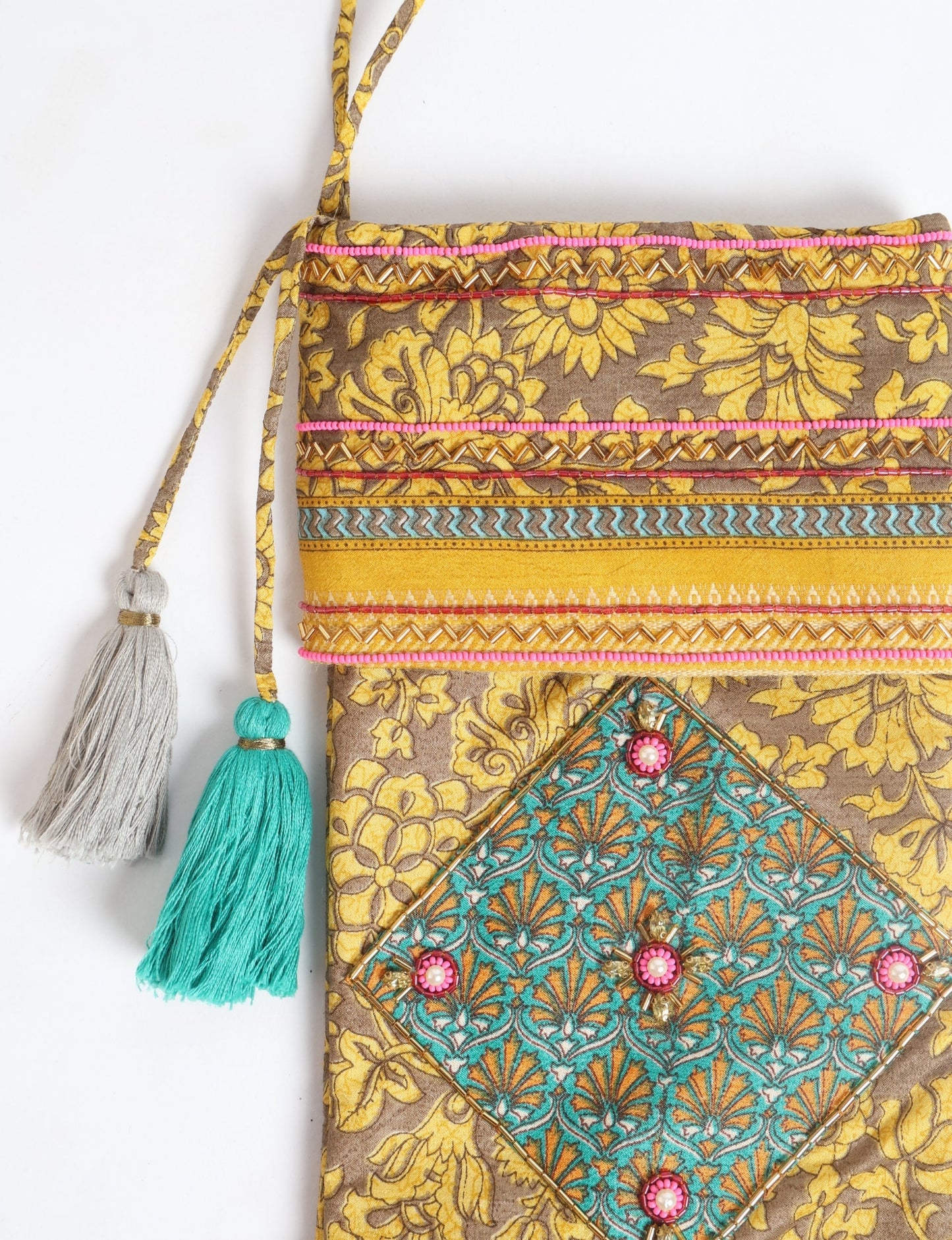 Cheer Christmas stocking made from recycled sari fabric with patchwork, gold hand embroidery, stones, sequins, pearls, glass beads, heart charm, and tassel — upcycled women’s clothing, conscious clothing, green fashion, upcycling fashion, environmentally friendly clothing, products made from textile waste, repurposed clothing, carbon neutral fashion, eco clothing, natural clothing.