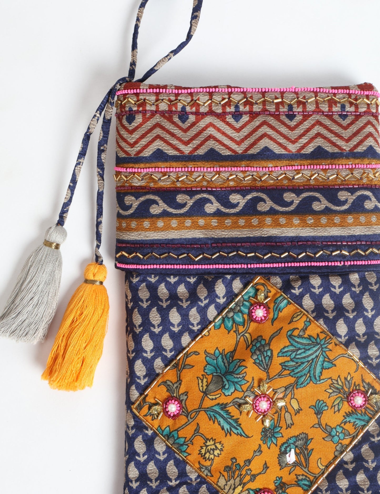 Cheer Christmas stocking made from recycled sari fabric with patchwork, gold hand embroidery, stones, sequins, pearls, glass beads, heart charm, and tassel — upcycled women’s clothing, conscious clothing, green fashion, upcycling fashion, environmentally friendly clothing, products made from textile waste, repurposed clothing, carbon neutral fashion, eco clothing, natural clothing.