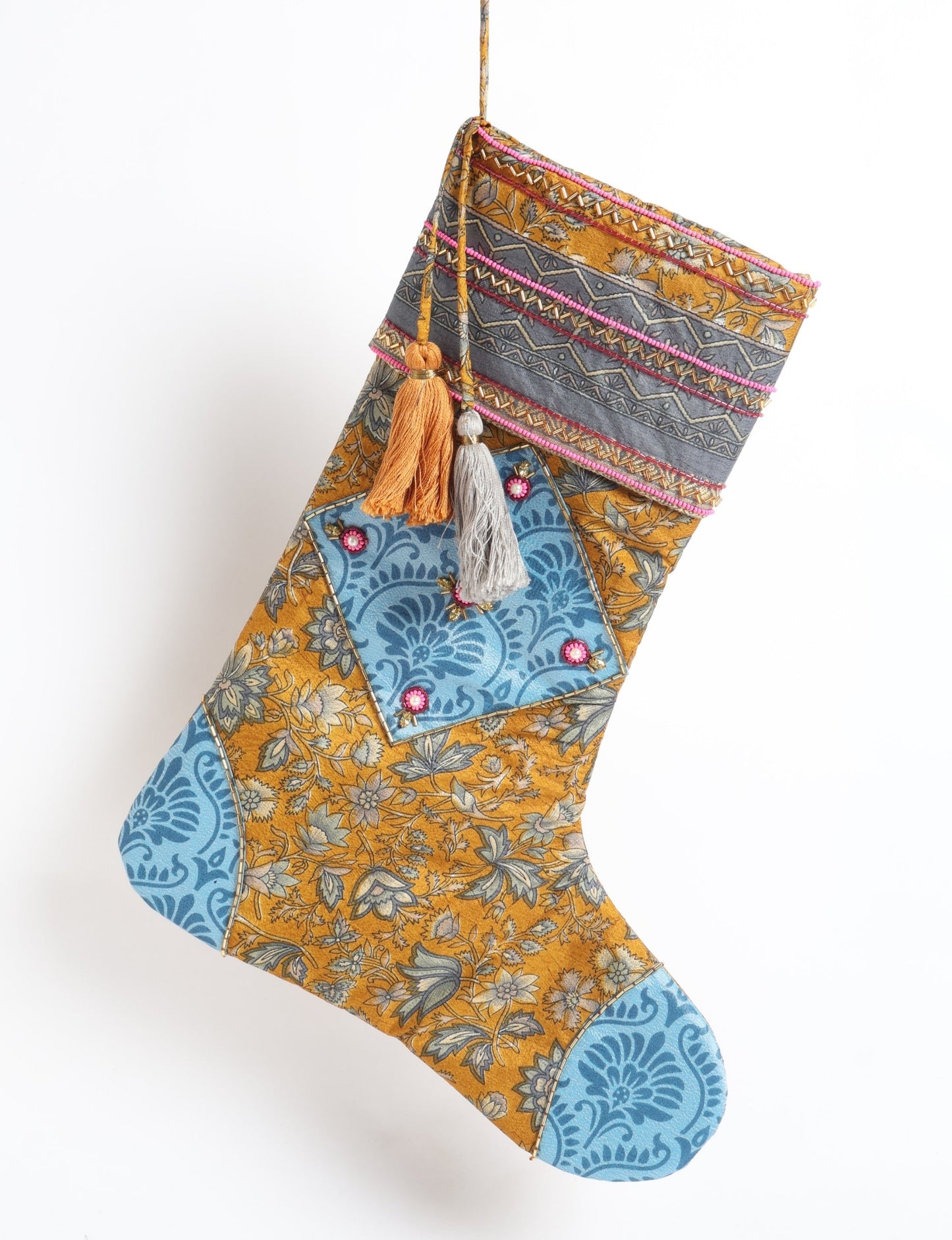 Cheer Christmas stocking made from recycled sari fabric with patchwork, gold hand embroidery, stones, sequins, pearls, glass beads, heart charm, and tassel — upcycled women’s clothing, conscious clothing, green fashion, upcycling fashion, environmentally friendly clothing, products made from textile waste, repurposed clothing, carbon neutral fashion, eco clothing, natural clothing.