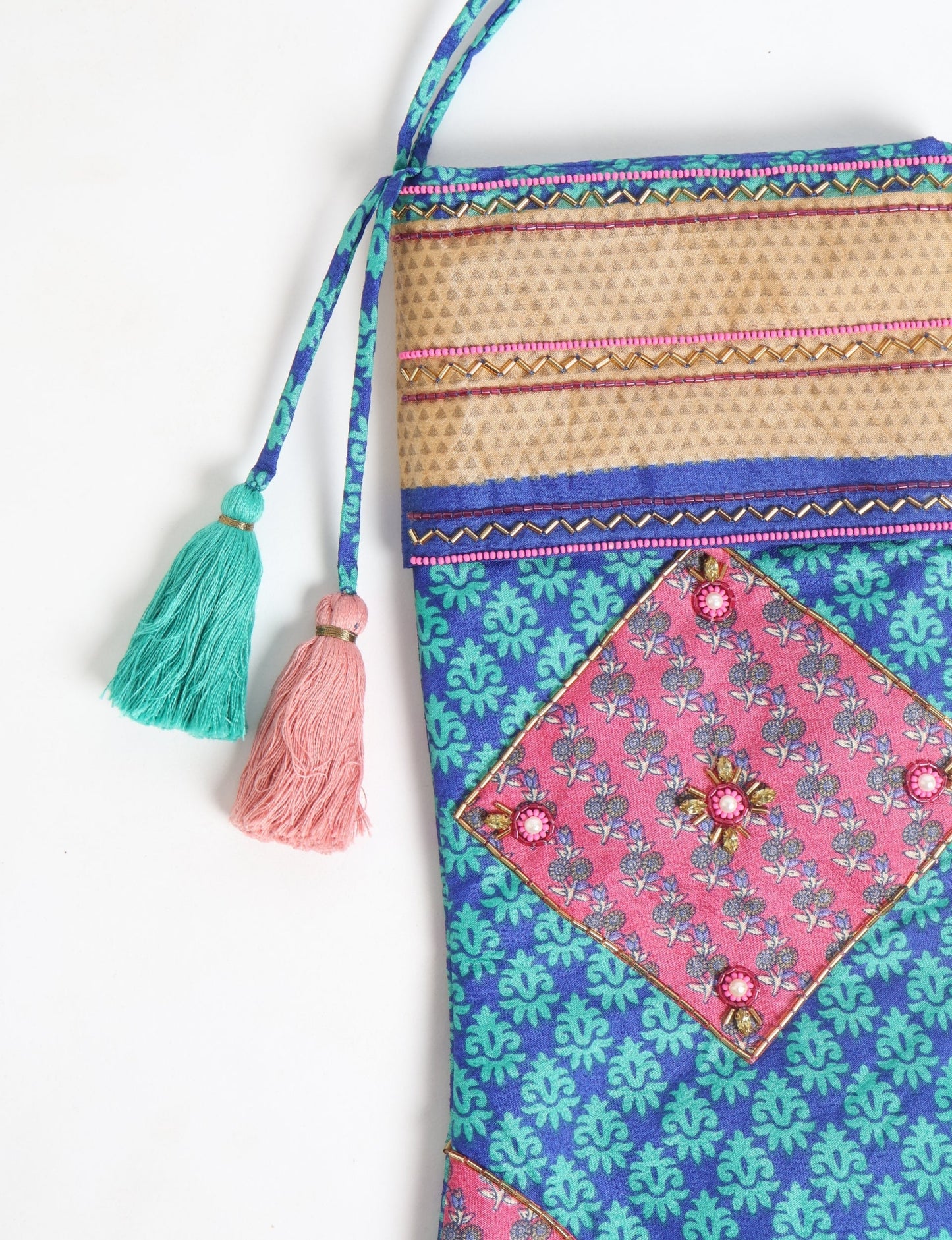 Cheer Christmas stocking made from recycled sari fabric with patchwork, gold hand embroidery, stones, sequins, pearls, glass beads, heart charm, and tassel — upcycled women’s clothing, conscious clothing, green fashion, upcycling fashion, environmentally friendly clothing, products made from textile waste, repurposed clothing, carbon neutral fashion, eco clothing, natural clothing.