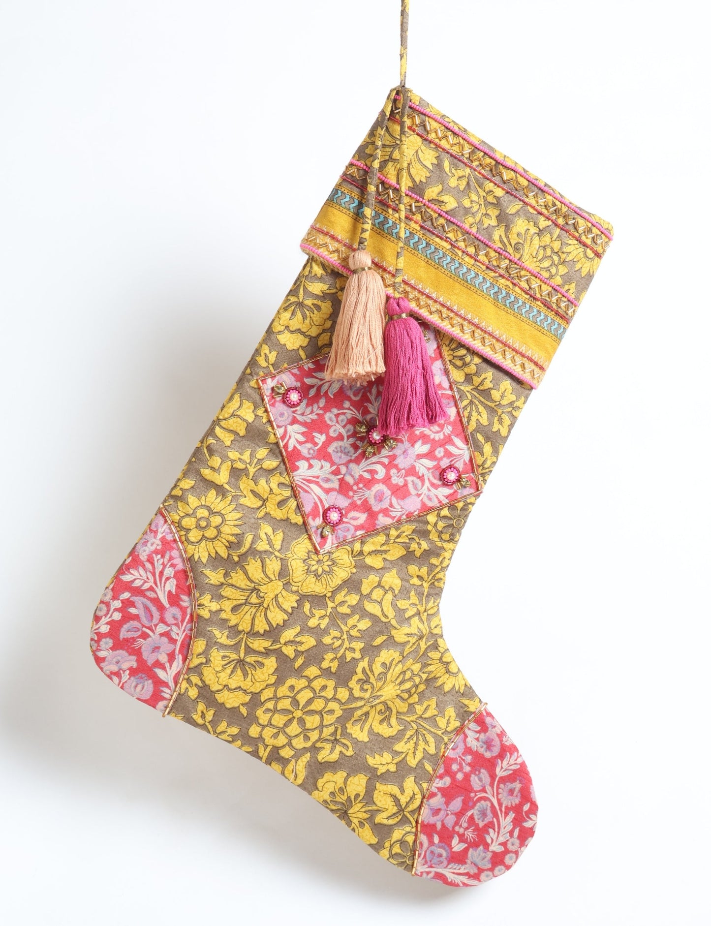 Cheer Christmas stocking made from recycled sari fabric with patchwork, gold hand embroidery, stones, sequins, pearls, glass beads, heart charm, and tassel — upcycled women’s clothing, conscious clothing, green fashion, upcycling fashion, environmentally friendly clothing, products made from textile waste, repurposed clothing, carbon neutral fashion, eco clothing, natural clothing.