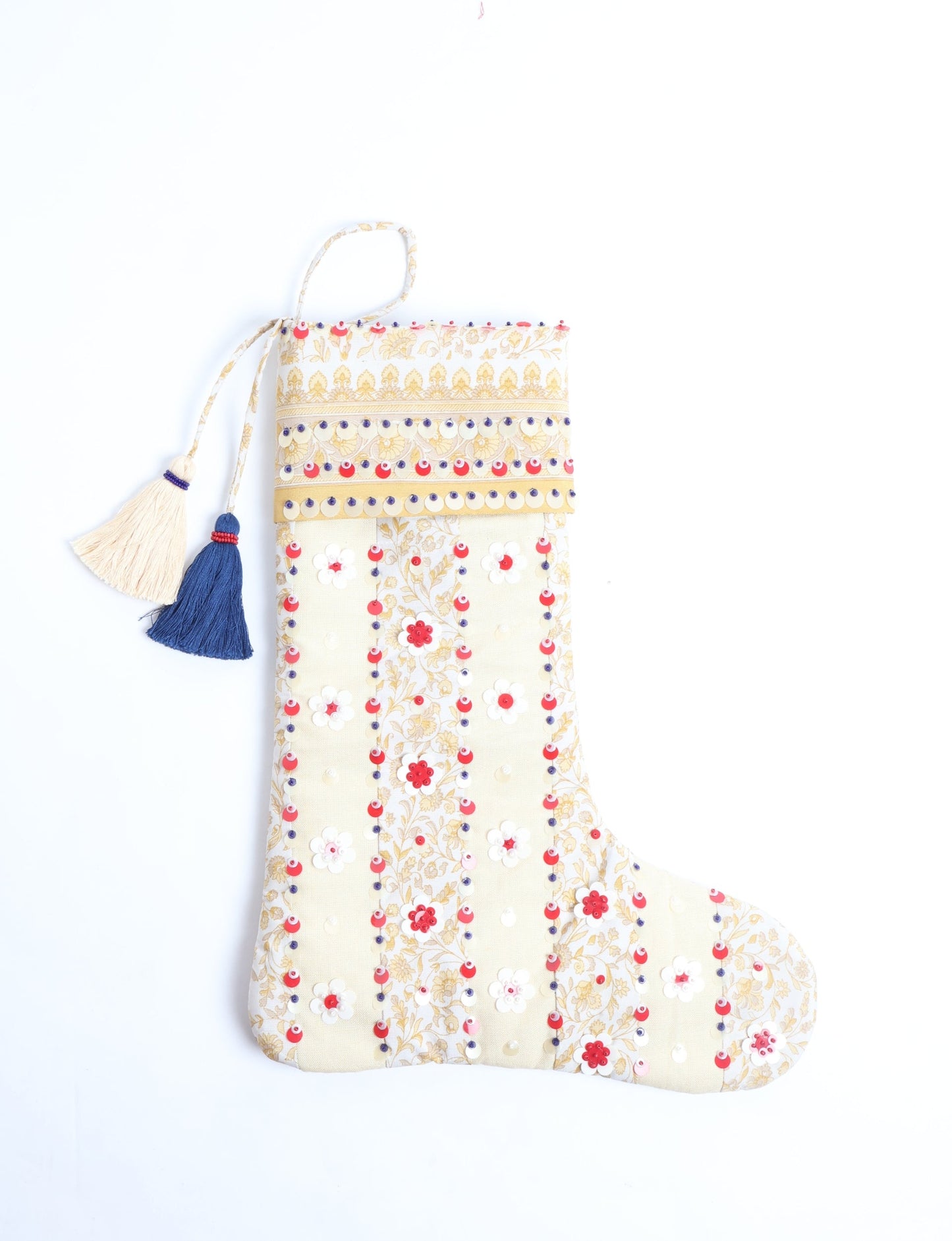 Upcycled sari Christmas stocking with floral beadwork, showcasing ethical fashion, recycled material clothing, fair trade fashion craftsmanship, and environment friendly clothing design.
