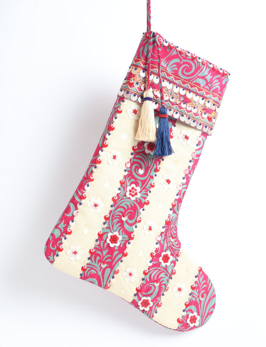 Upcycled sari Christmas stocking with floral beadwork, showcasing ethical fashion, recycled material clothing, fair trade fashion craftsmanship, and environment friendly clothing design.