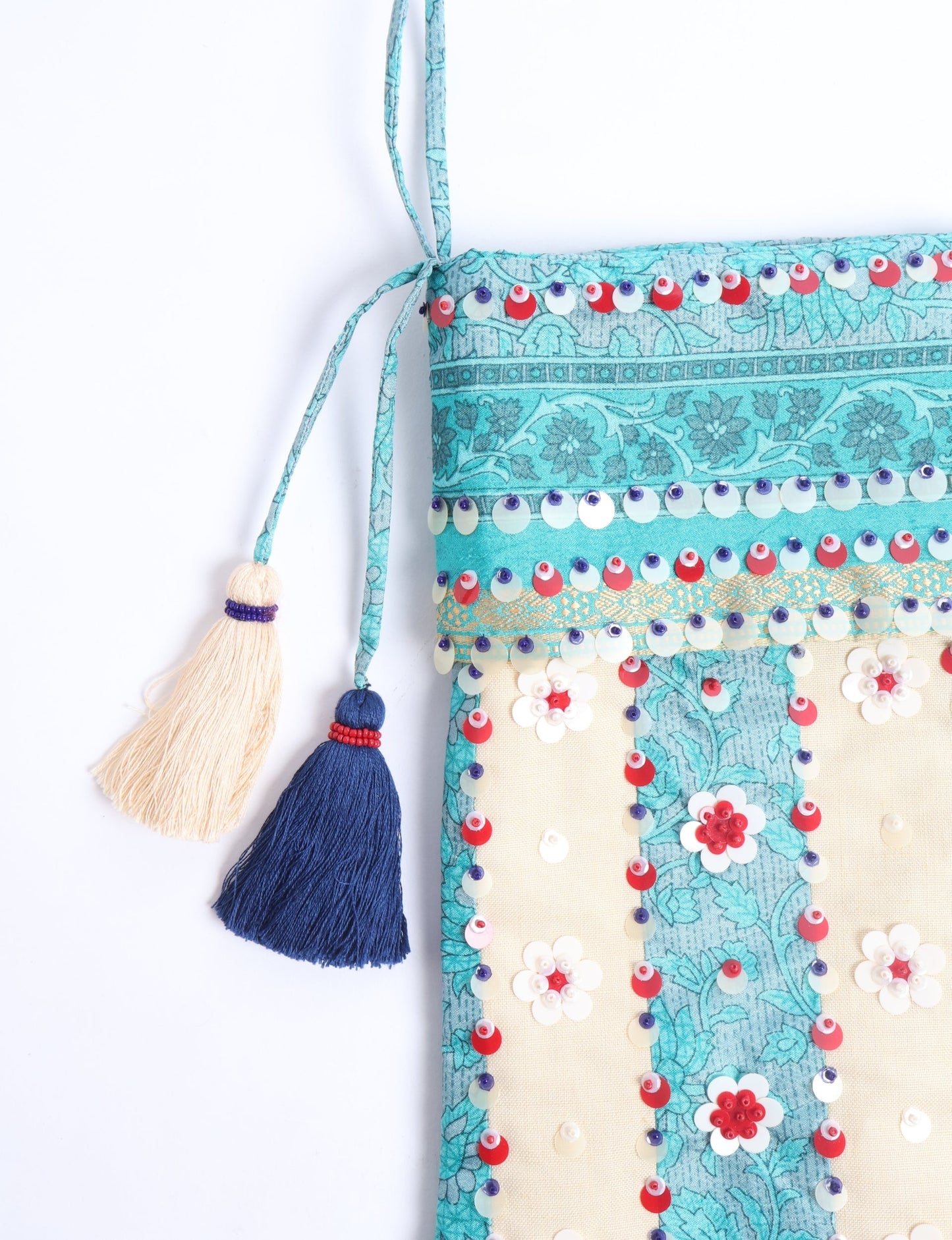 Upcycled sari Christmas stocking with floral beadwork, showcasing ethical fashion, recycled material clothing, fair trade fashion craftsmanship, and environment friendly clothing design.